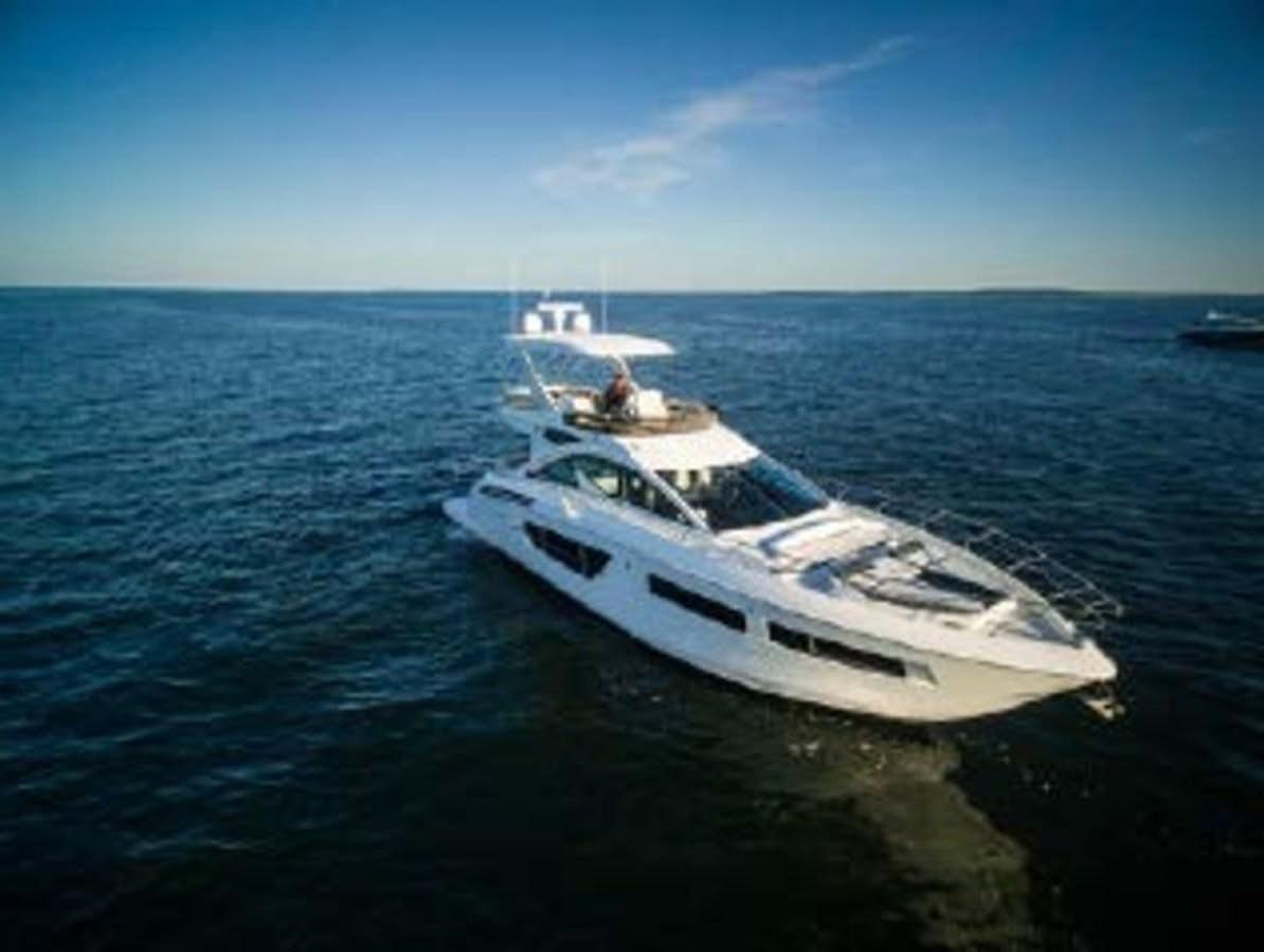 a white yacht in the water aboard 54 FT 2023 CRUISERS  54 FLY Yacht for Sale