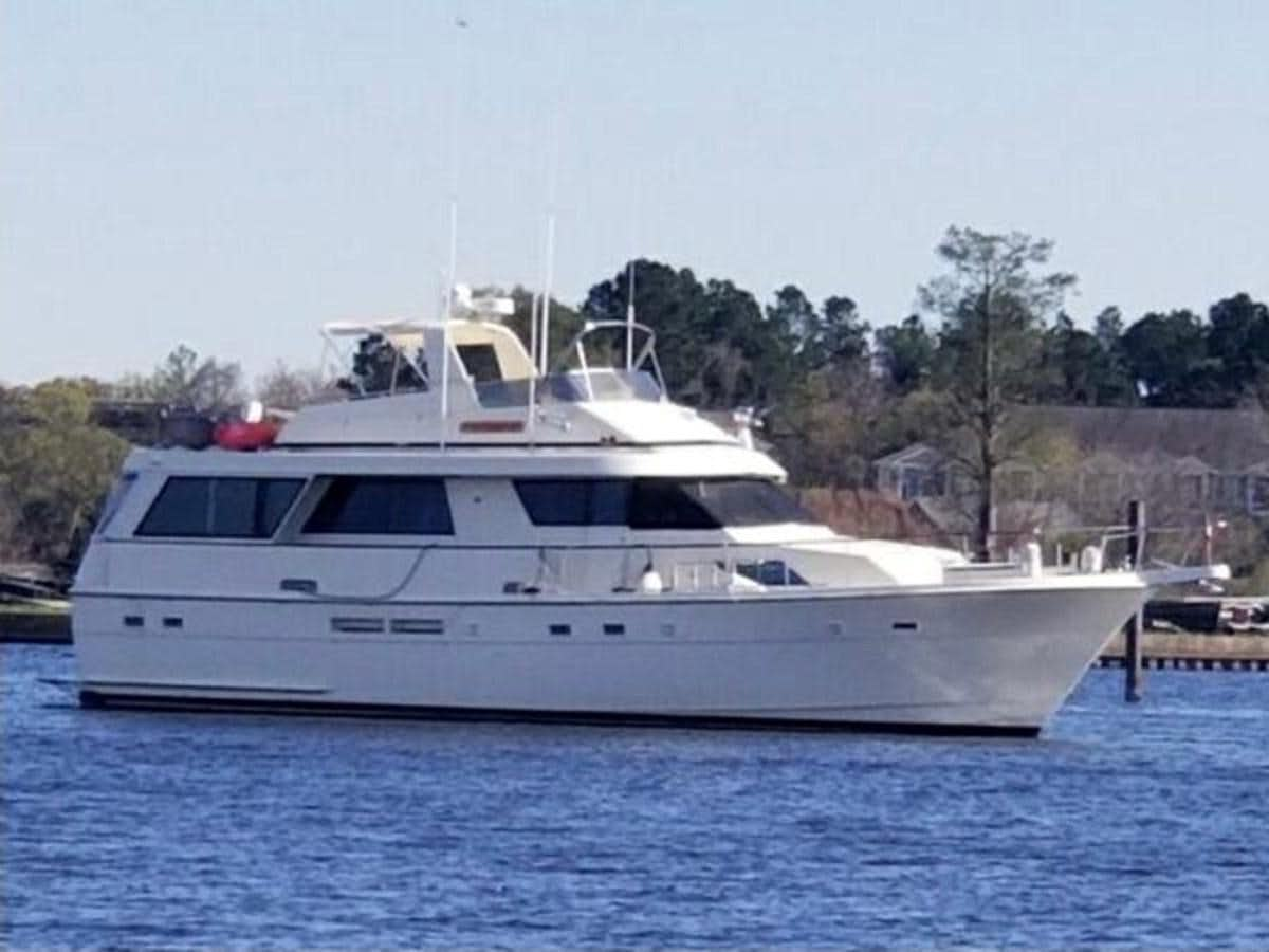 a white yacht in a harbor aboard 60 MOTOR YACHT Yacht for Sale