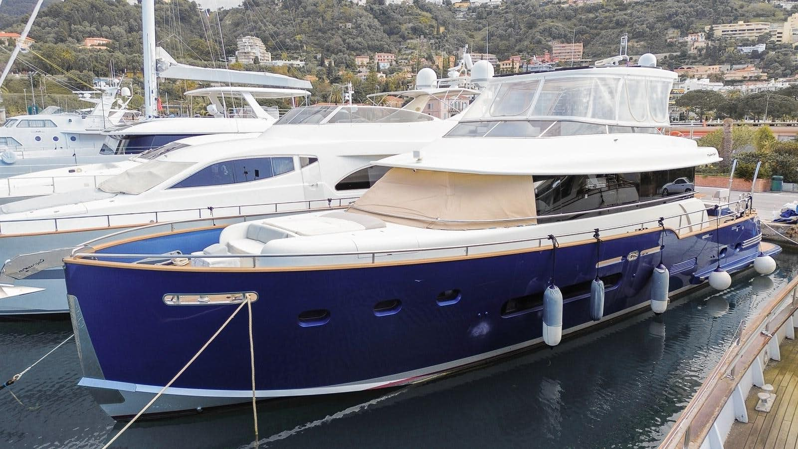 a boat docked at a pier aboard CHARISMA Yacht for Sale