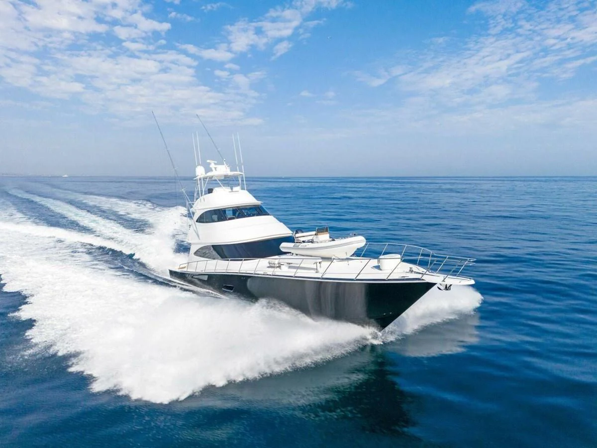 a white yacht on the water aboard TEAM MAYHEM Yacht for Sale