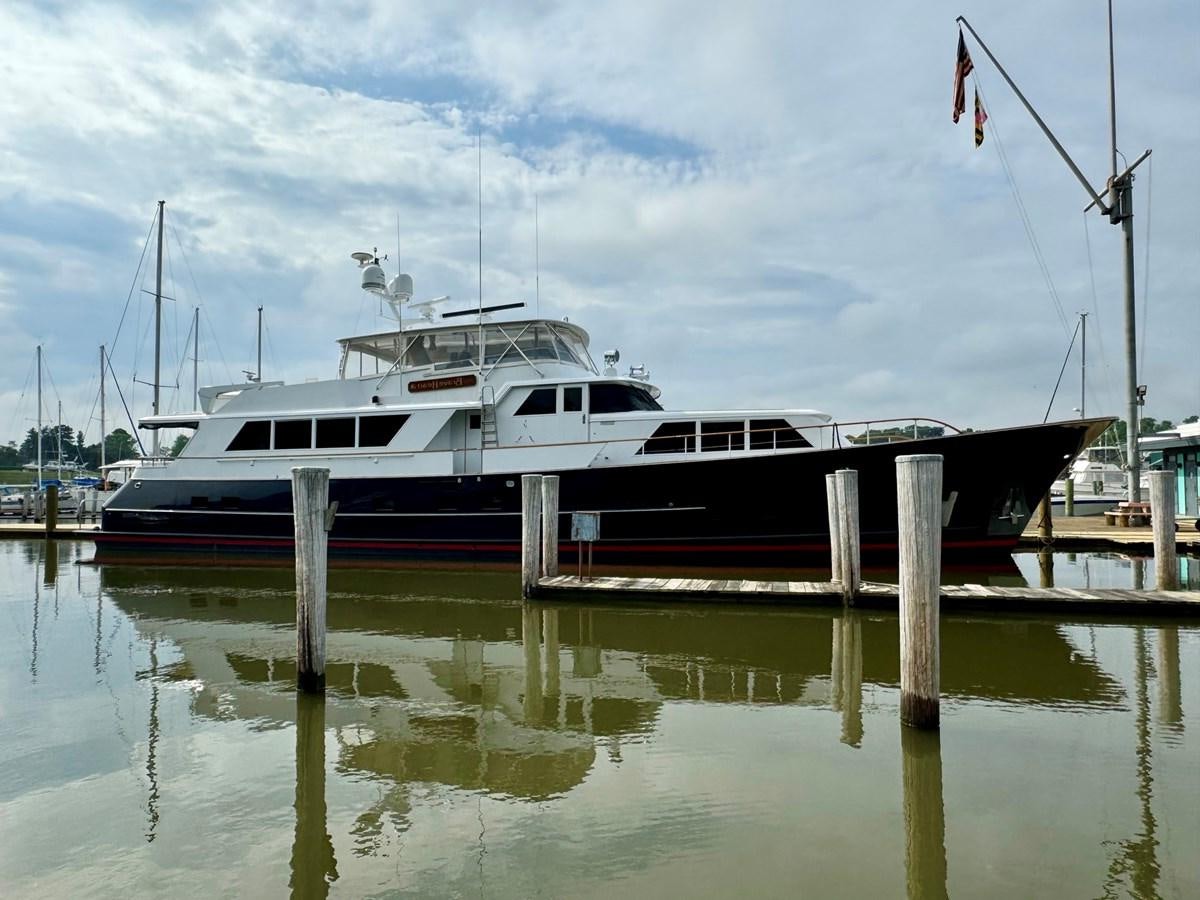 a boat docked at a pier aboard BRAVEHEART Yacht for Sale