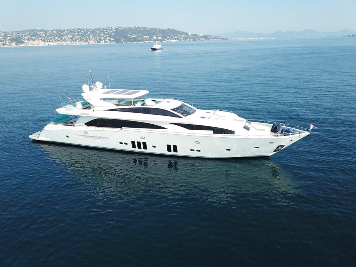 a white yacht in the water aboard ASCENSION Yacht for Sale