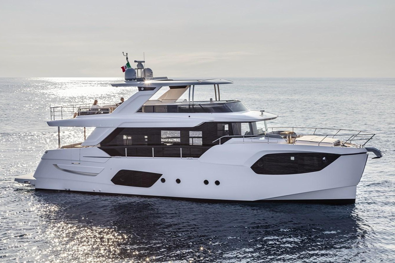 a white yacht on the water aboard 2025 ABSOLUTE NAVERTTA 68 Yacht for Sale