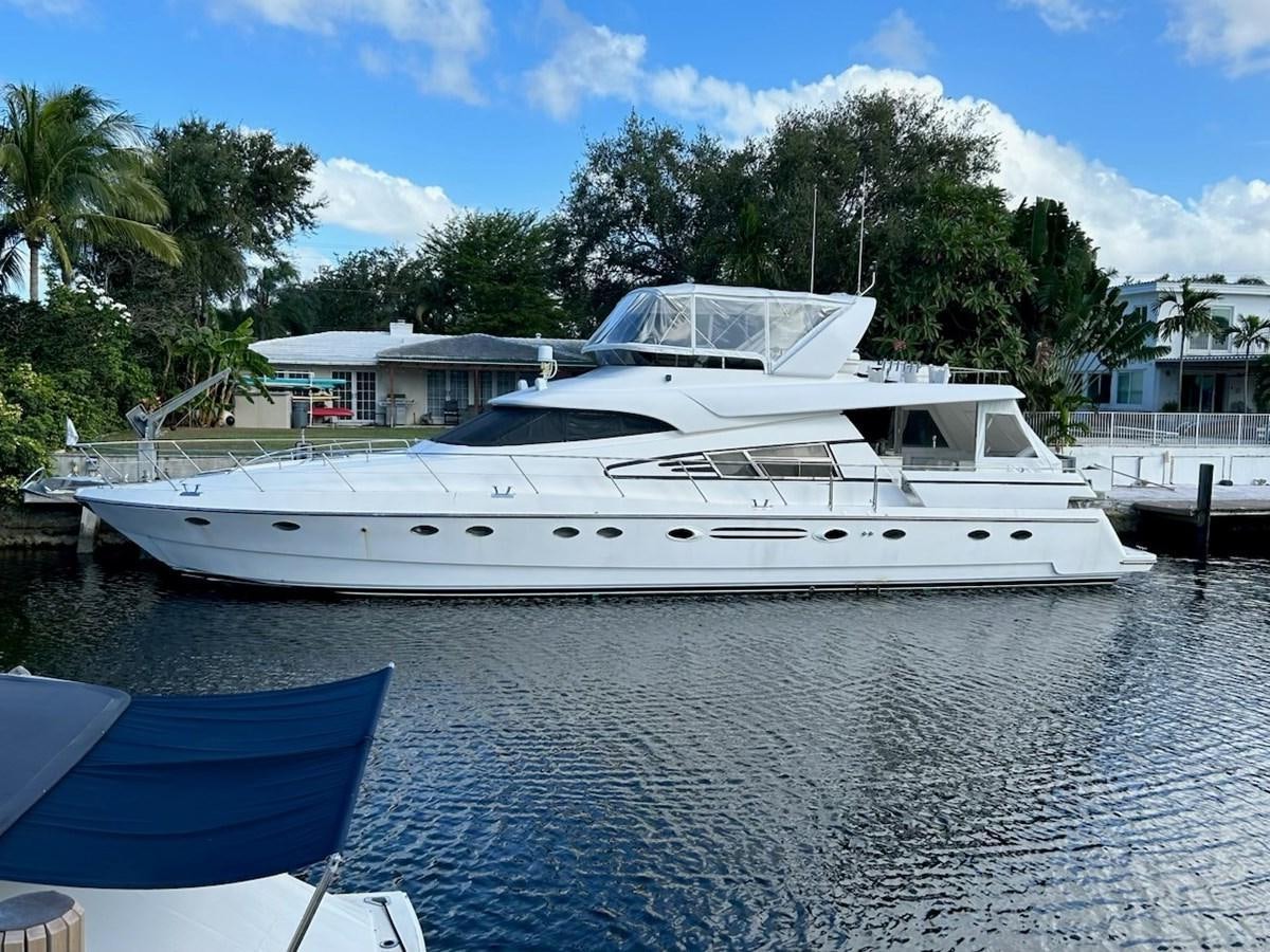 a white yacht in the water aboard MADNESS Yacht for Sale
