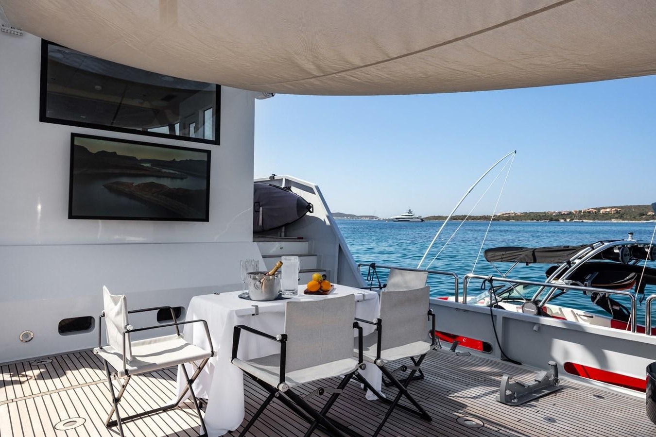 a table and chairs on a boat aboard SHADOW Yacht for Sale