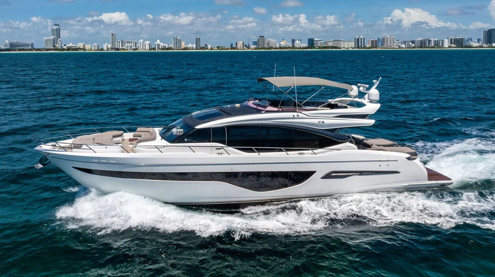 a white boat on the water aboard COCOON Yacht for Sale