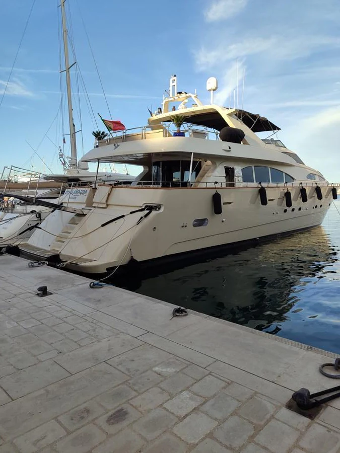 A luxurious yacht is docked at the marina, showcasing its elegant design and spacious decks. aboard ACCAMA DELTA Yacht for Sale