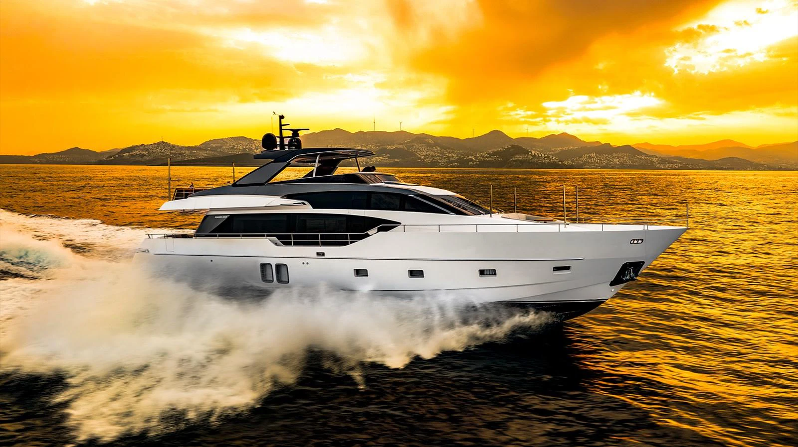 a white yacht on a beach aboard JOURNEY Yacht for Sale