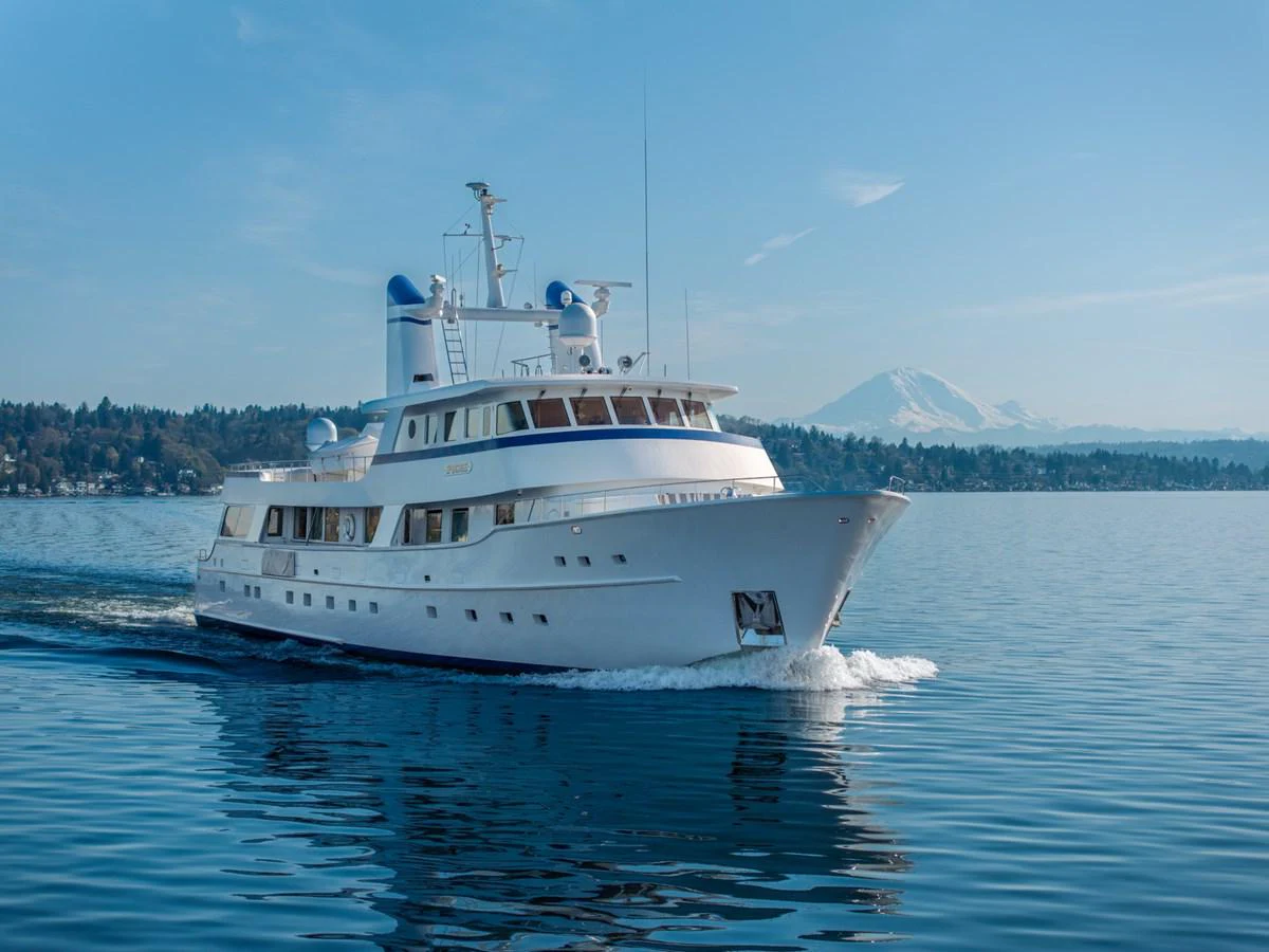 a white boat on the water aboard ESCAPE Yacht for Sale