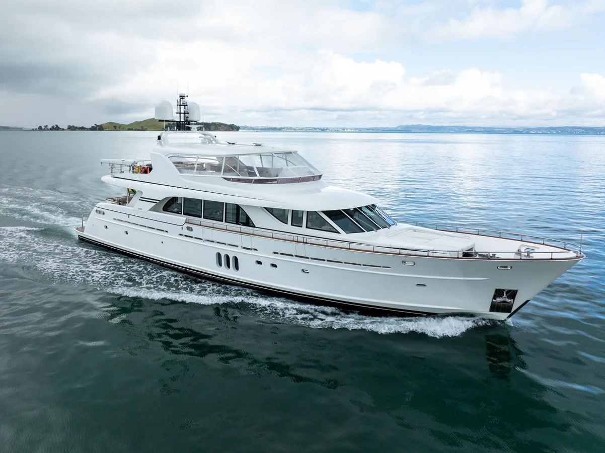a white yacht in the water aboard MAHALO Yacht for Sale