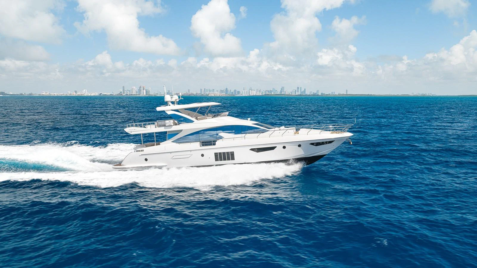 a white boat in the water aboard SABI Yacht for Sale