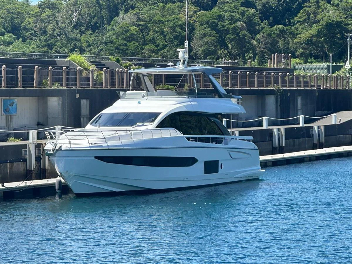 a white yacht docked at a pier aboard ANGEL Yacht for Sale