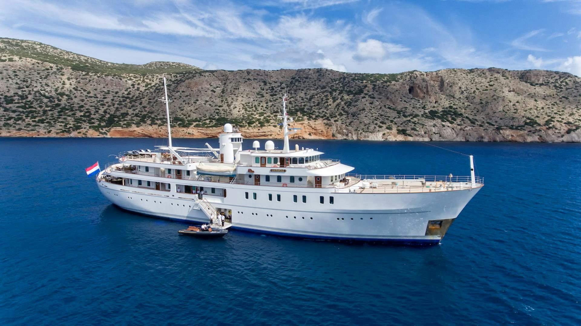 a large white boat in the water aboard SHERAKHAN Yacht for Sale