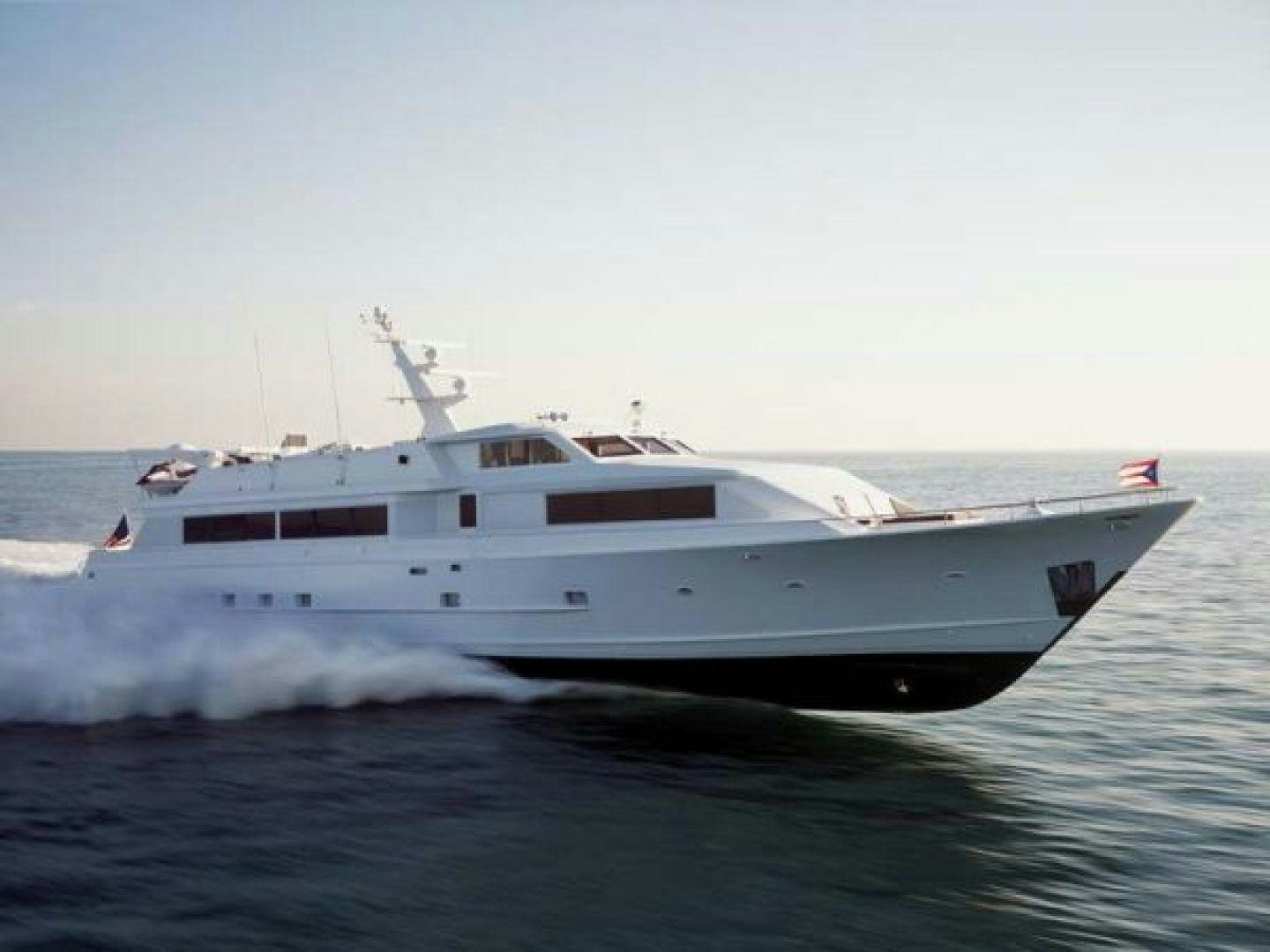 a white yacht in the water aboard THUNDERBALL Yacht for Sale