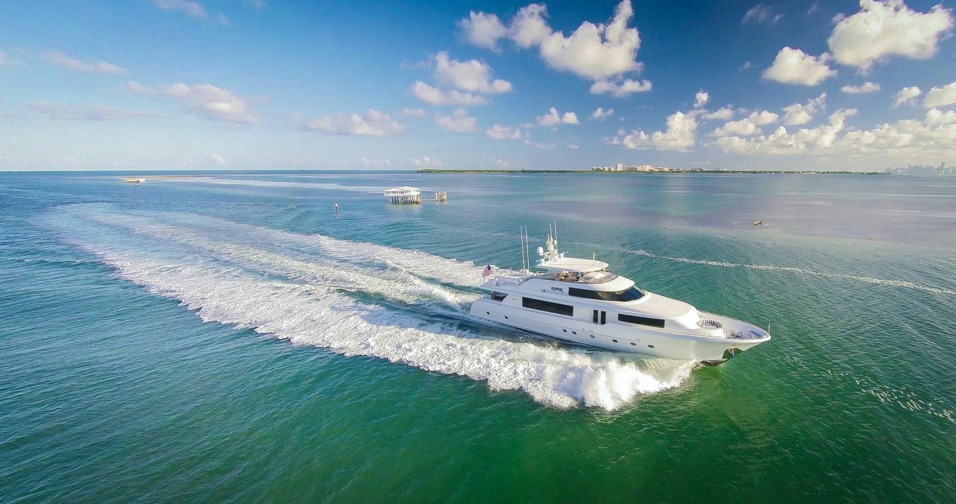 a white yacht on the water aboard NAUTI N' Yacht for Sale