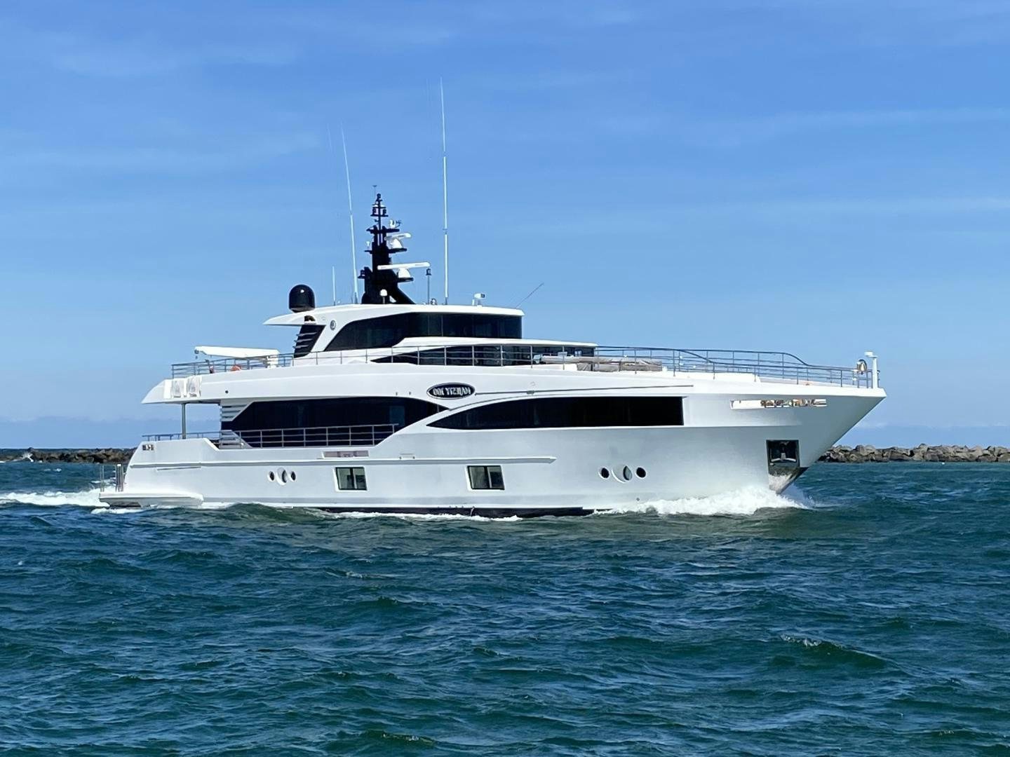 a white boat in the water aboard MAJESTY 100 Yacht for Sale