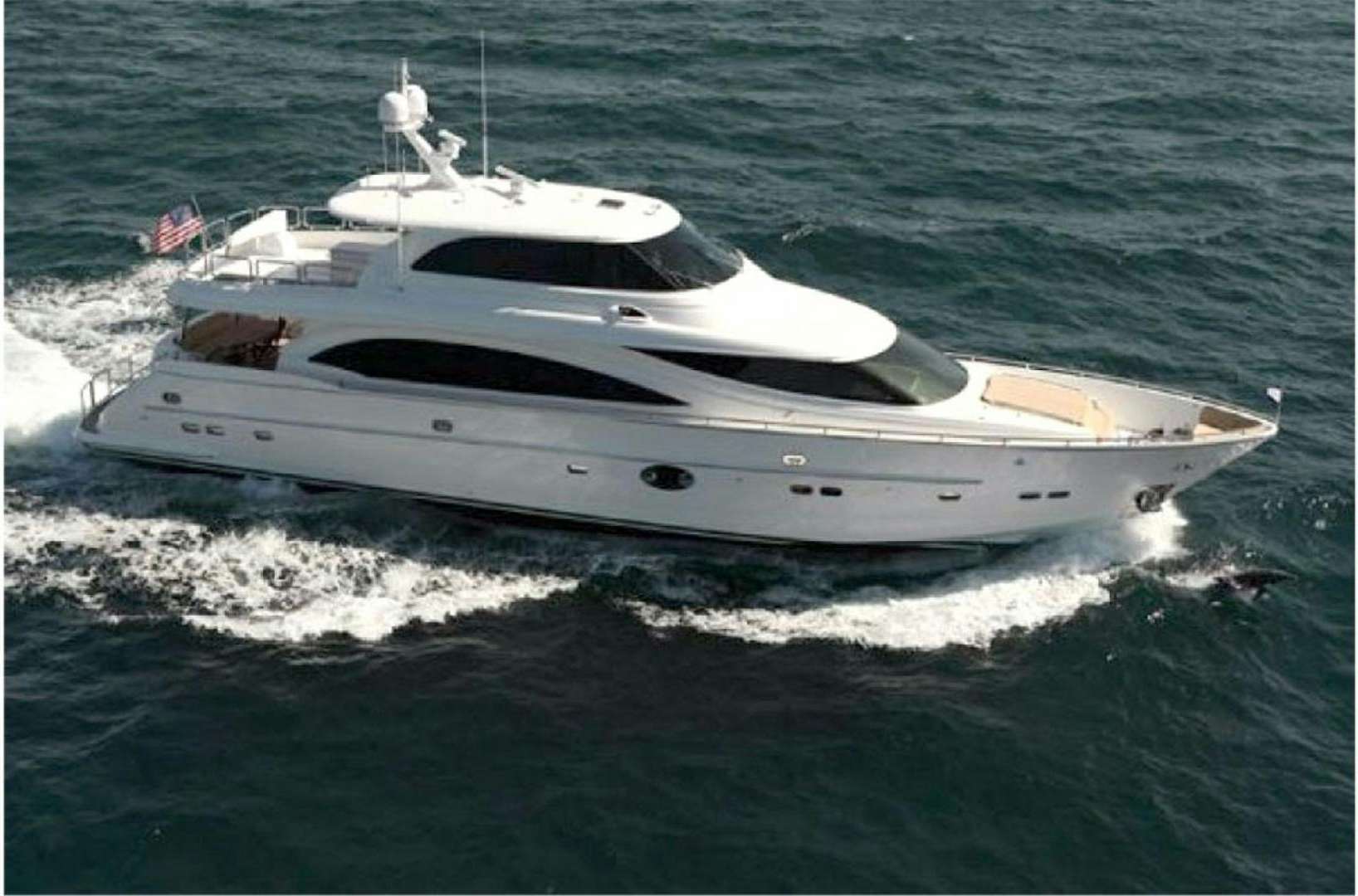 a white yacht on the water aboard LUCKY DOG Yacht for Sale