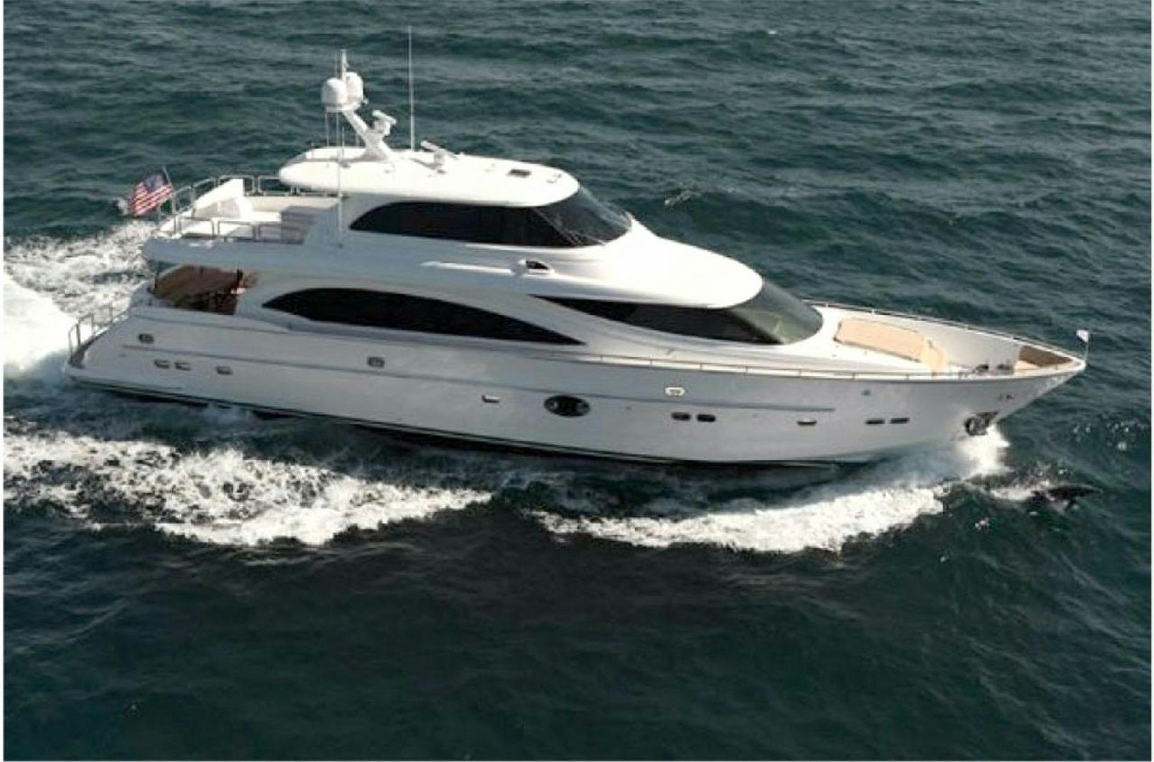 a white yacht on the water aboard LUCKY DOG Yacht for Sale