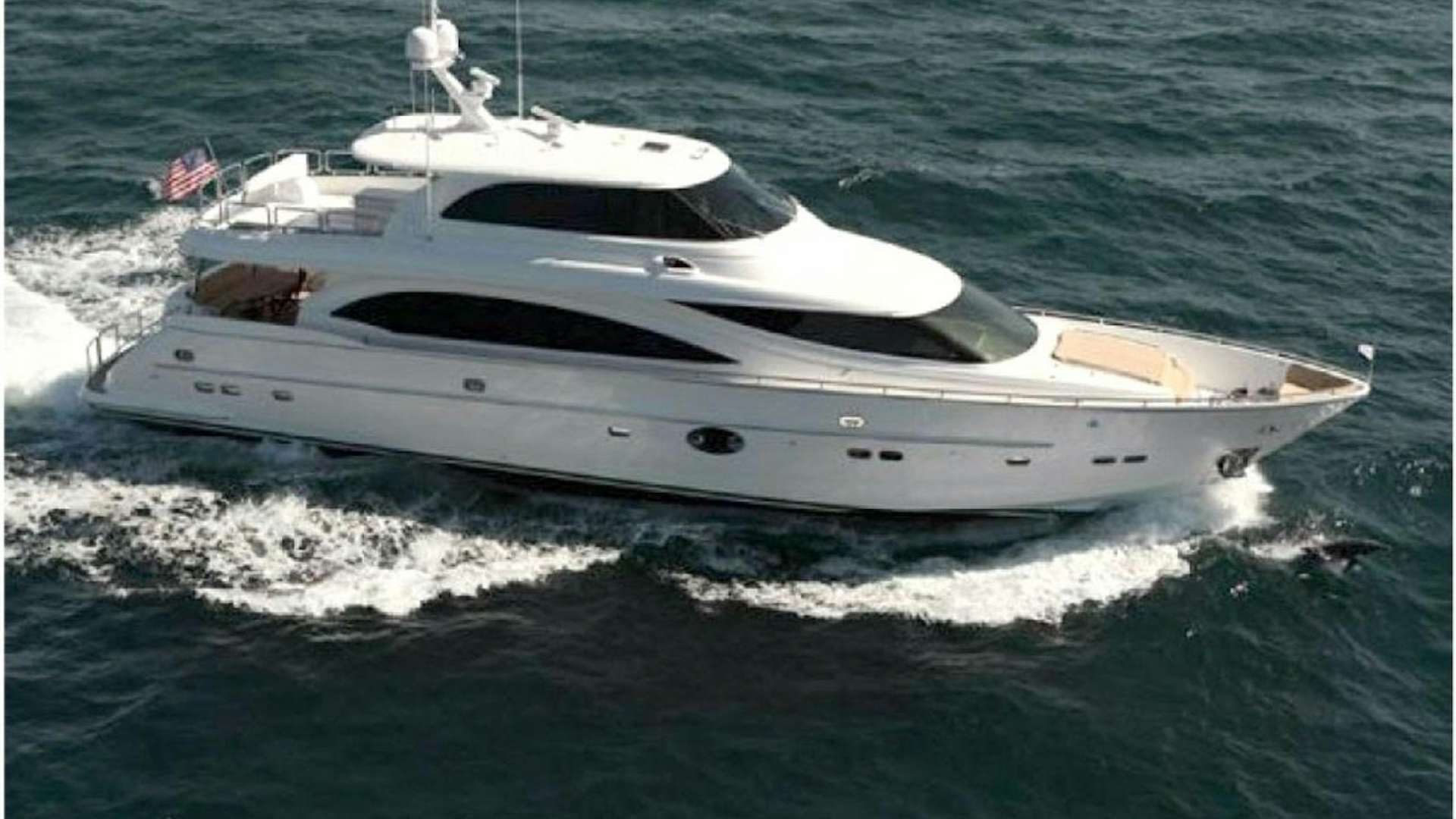 a white yacht on the water aboard LUCKY DOG Yacht for Sale