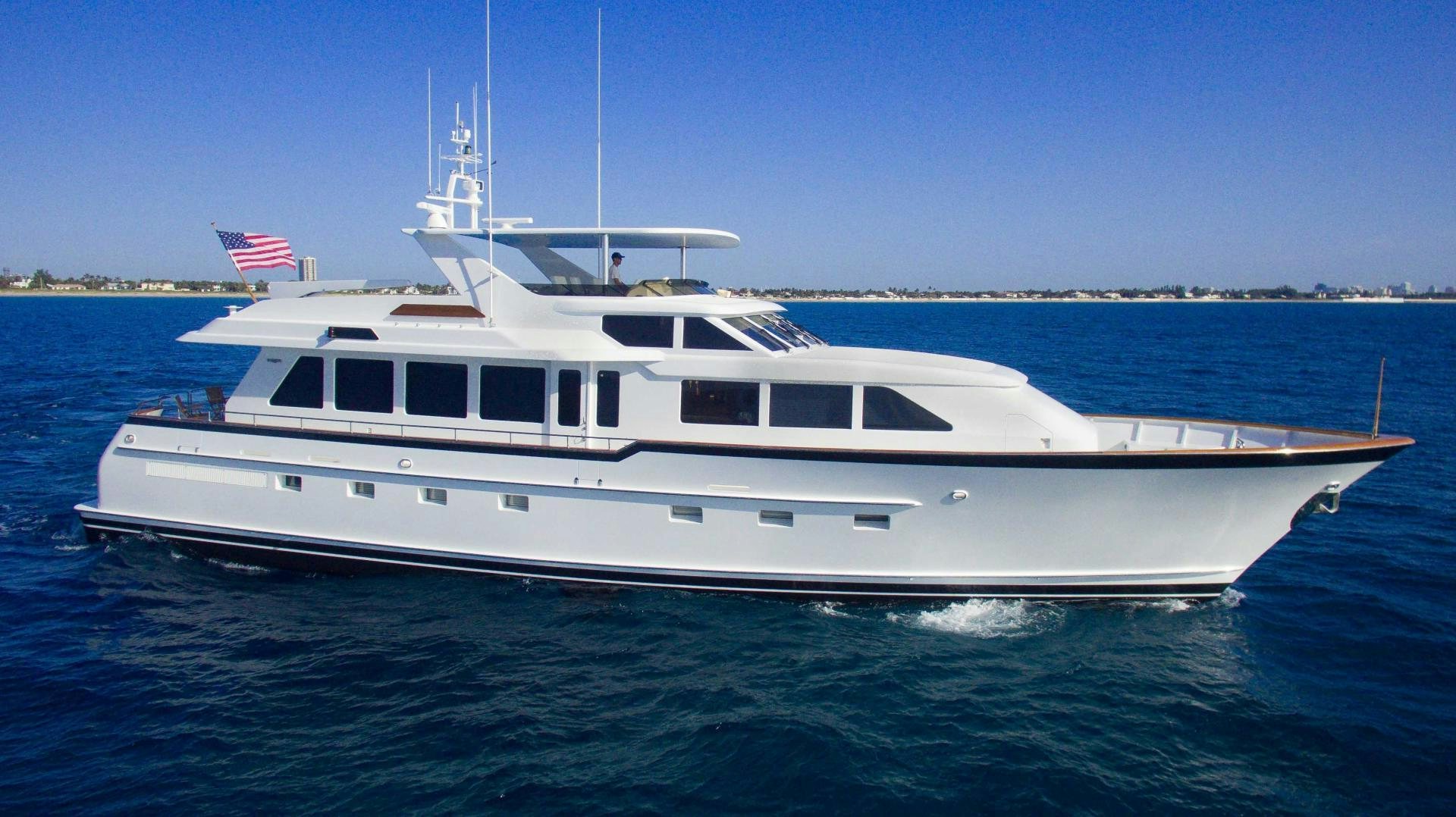 a white boat in the water aboard ROAMIN' HOLIDAY Yacht for Sale