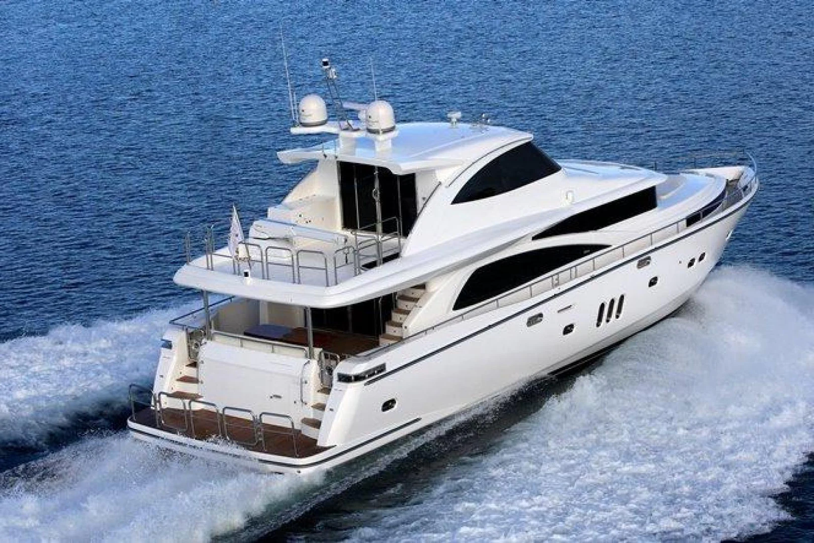 a white yacht in the water aboard JOHNSON 80' FLYBRIDGE W/FISHING COCKPIT Yacht for Sale