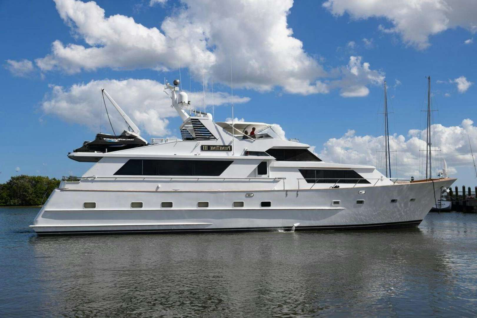 a large white yacht aboard PRIMETIME III Yacht for Sale