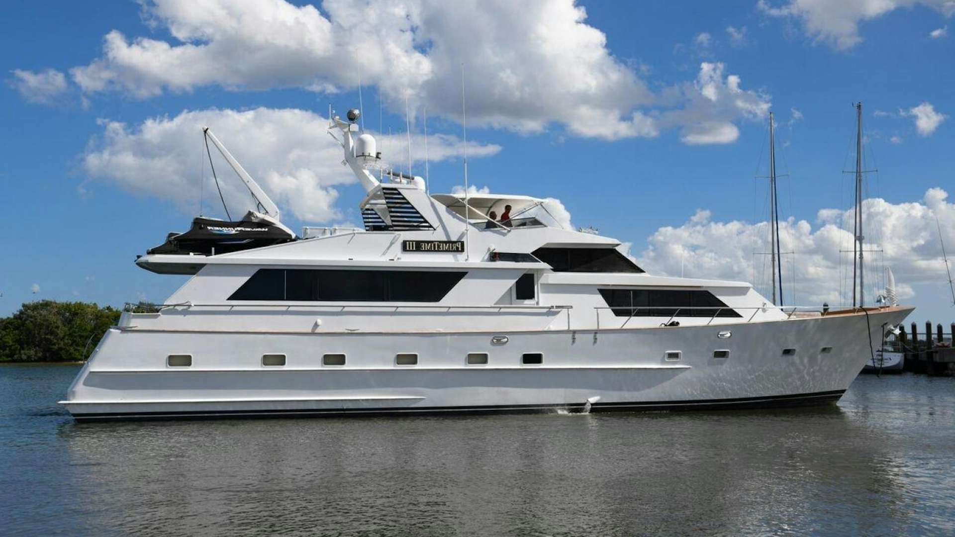 a large white yacht aboard PRIMETIME III Yacht for Sale