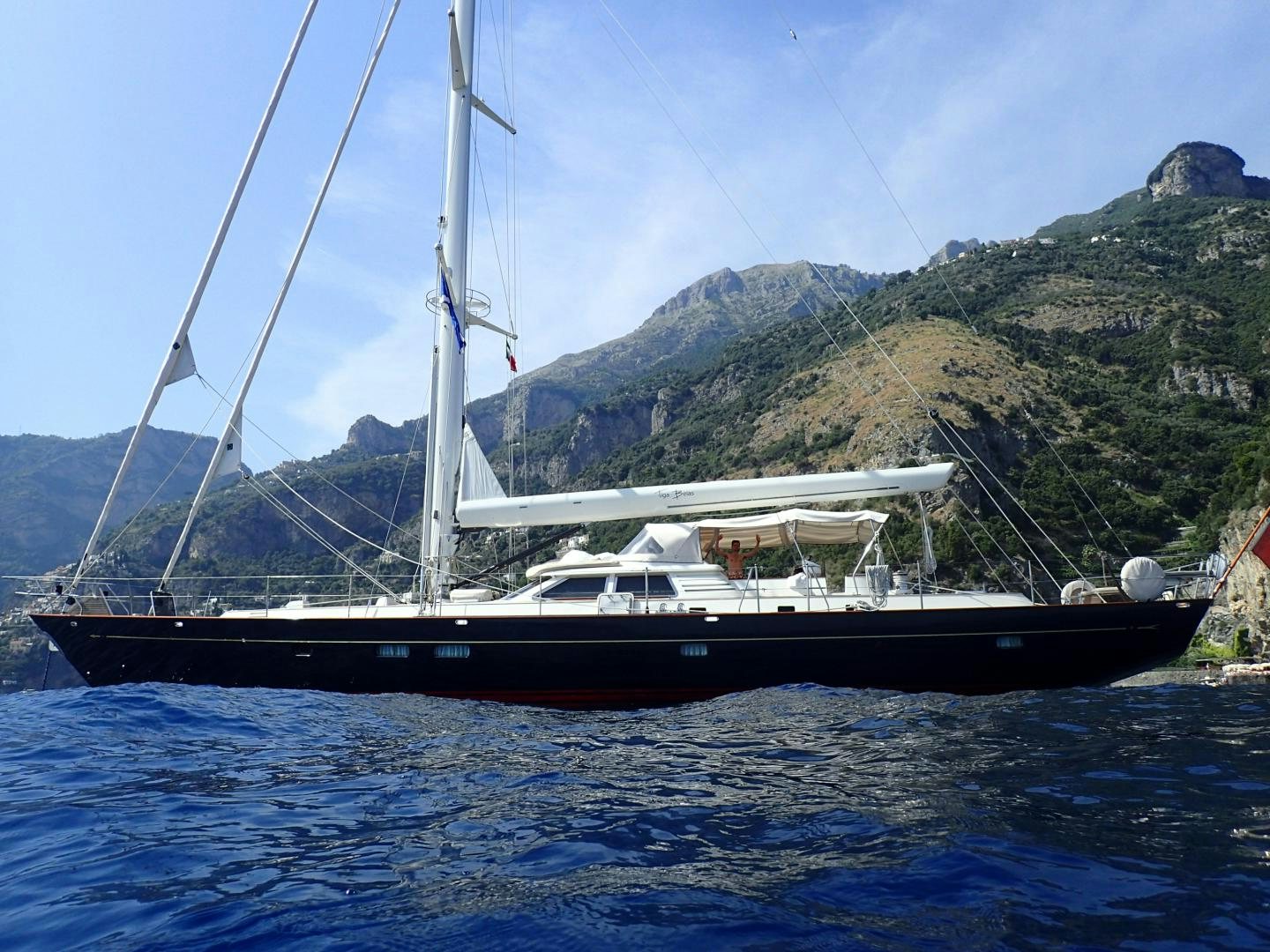 a boat on the water aboard TIGA BELAS Yacht for Sale