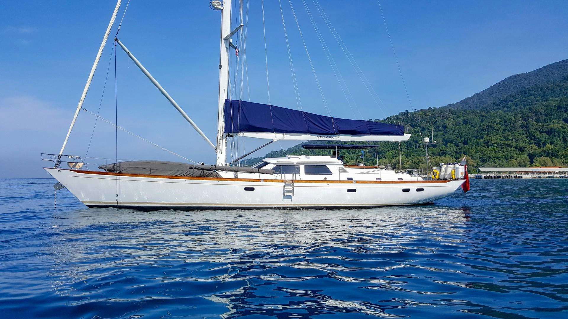 a white sailboat on the water aboard GOLDEN OPUS Yacht for Sale