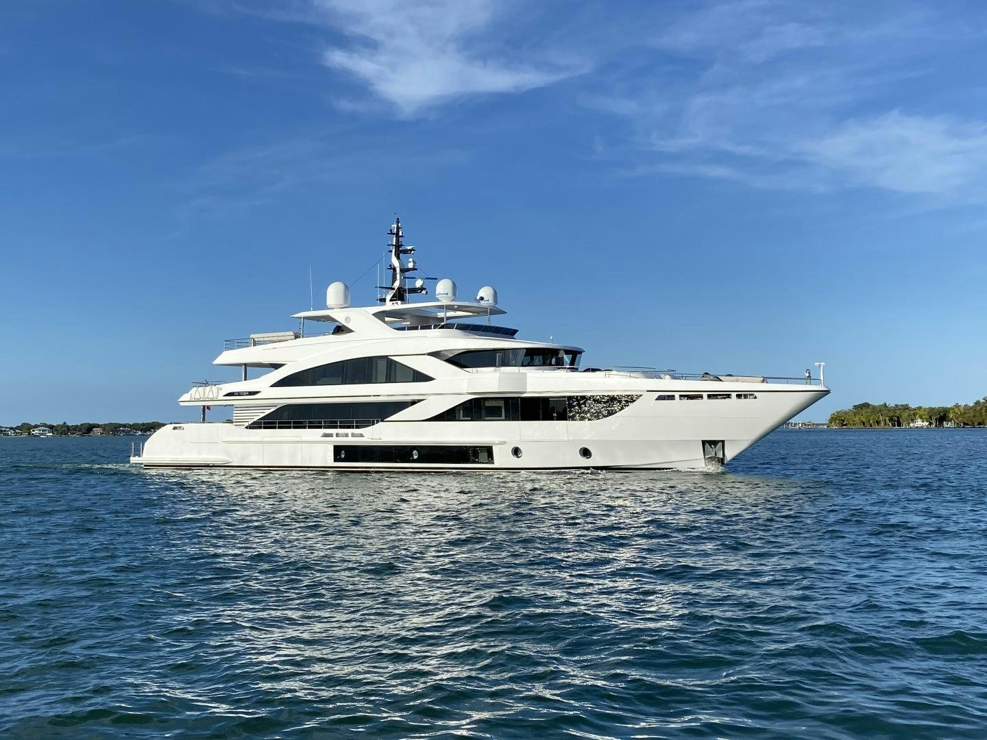 a white yacht on the water aboard LIRA Yacht for Sale