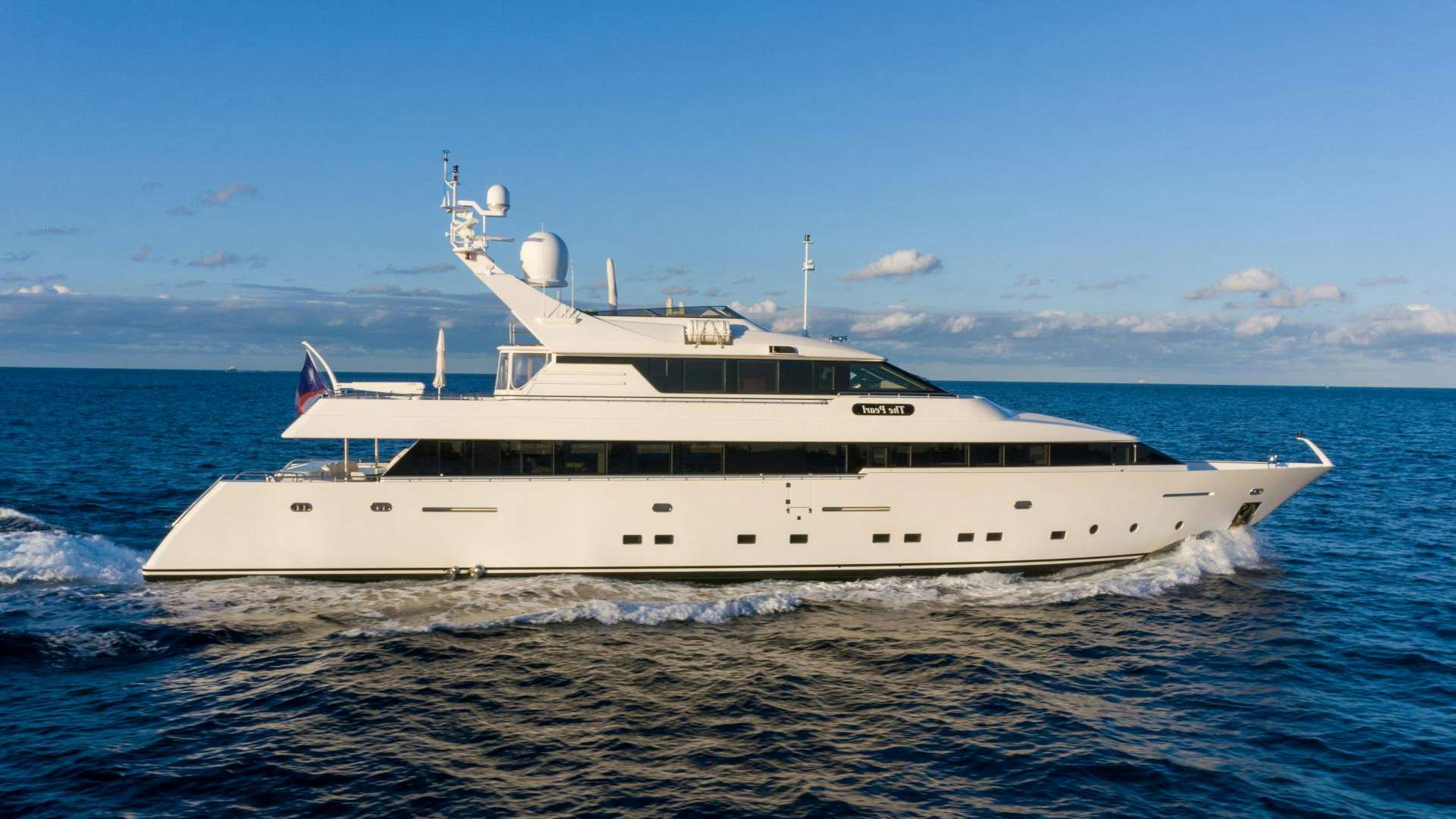 a large white boat in the water aboard THE PEARL Yacht for Sale