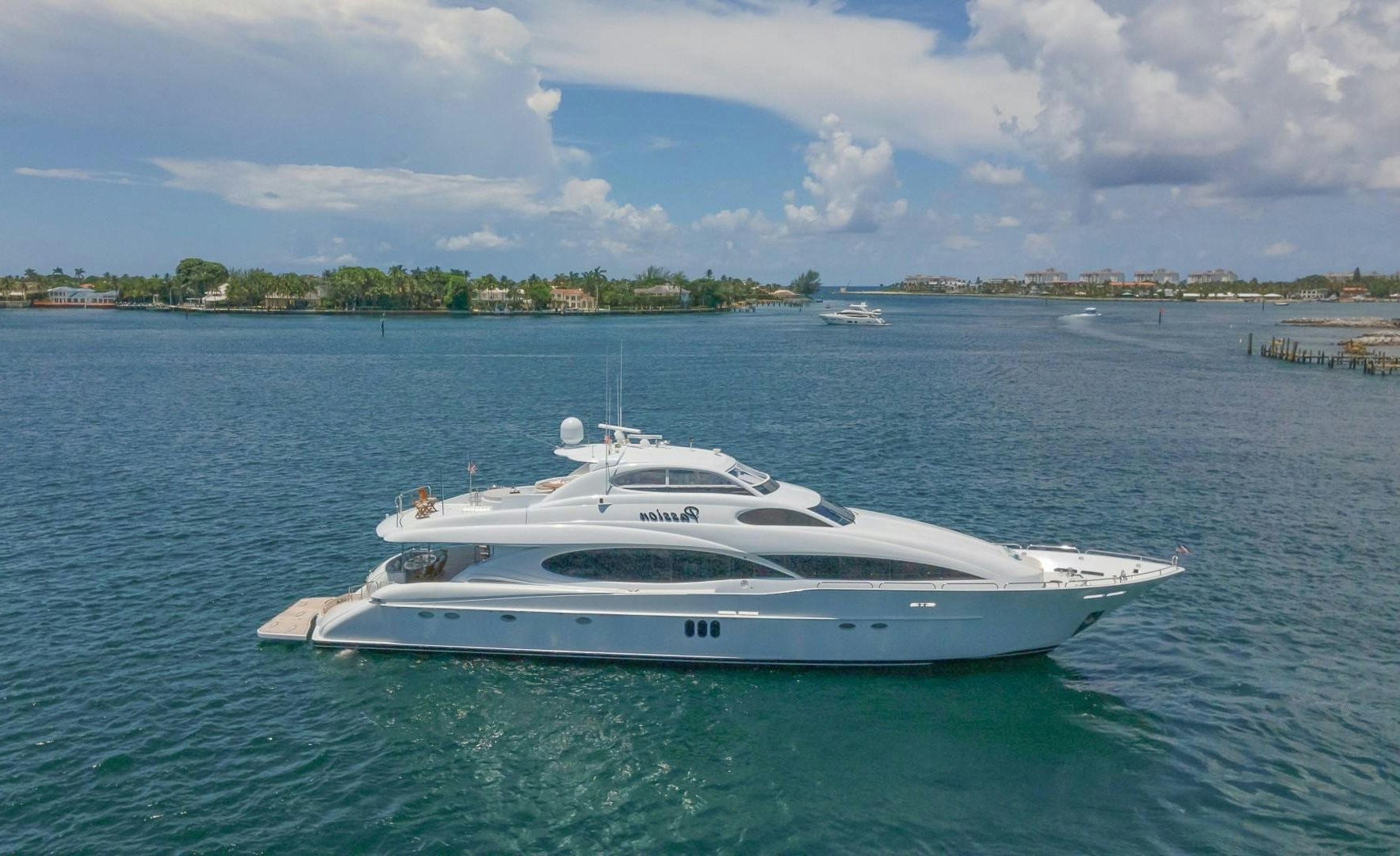 a white yacht in the water aboard PASSION Yacht for Sale