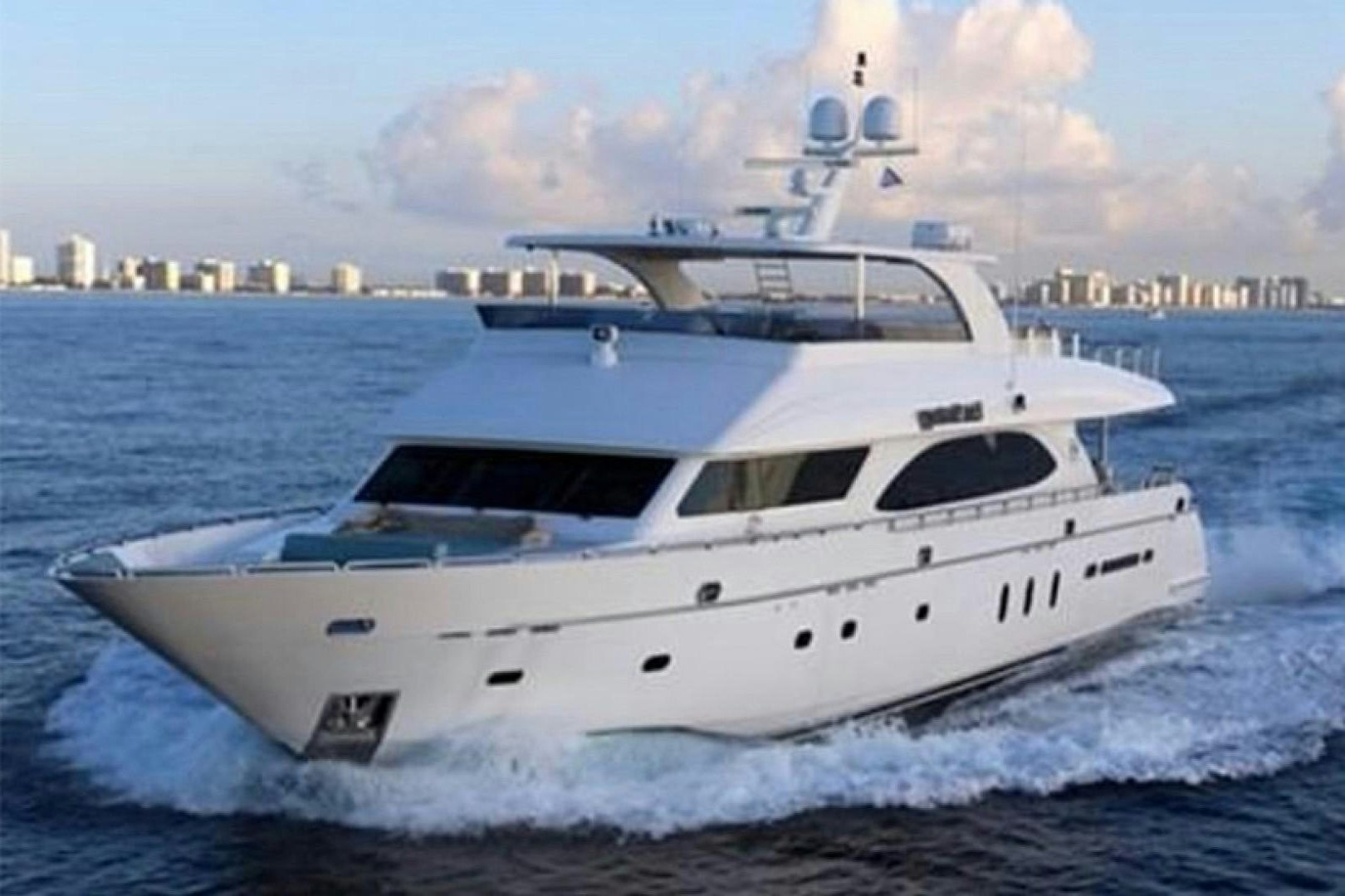 a white yacht on the water aboard EXIT STRATEGY Yacht for Sale