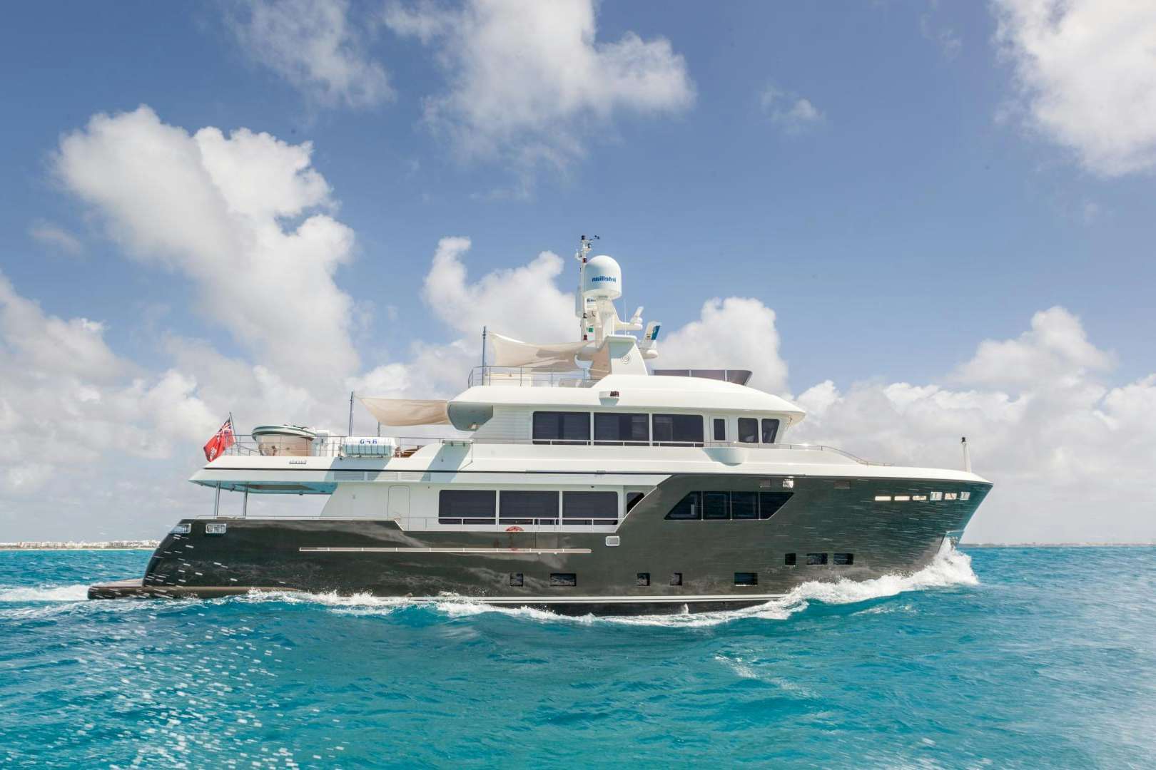 a large boat on the water aboard ACALA Yacht for Sale