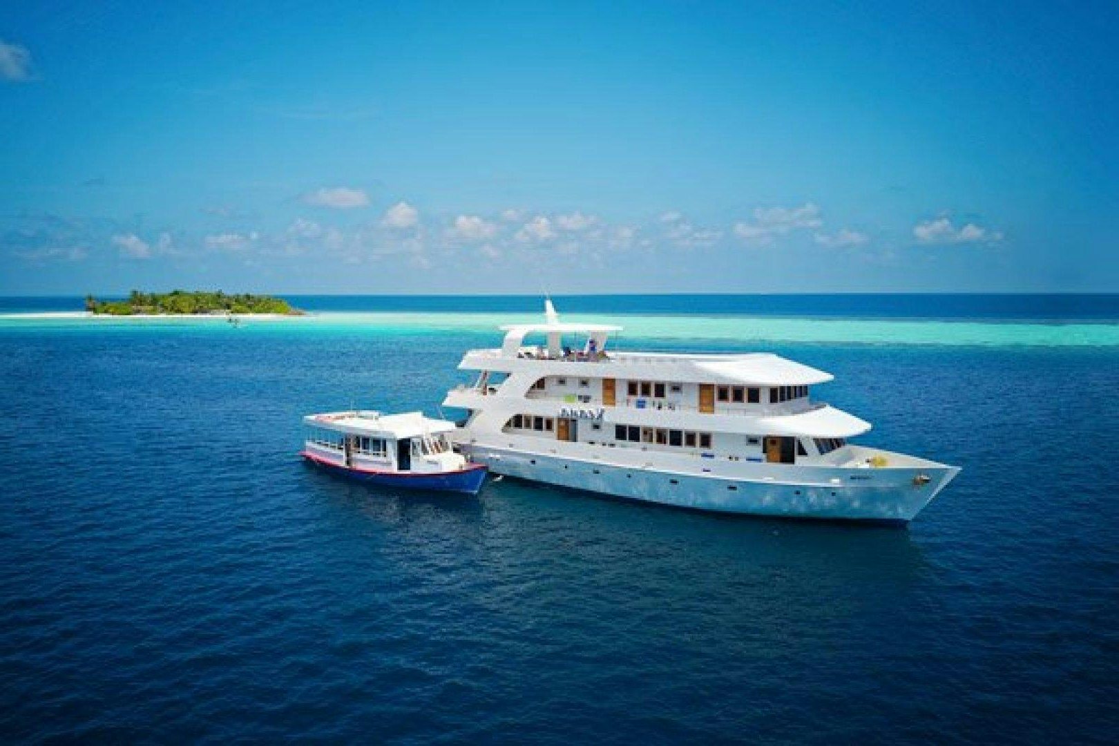 a couple of white boats in the water aboard KEANA Yacht for Sale
