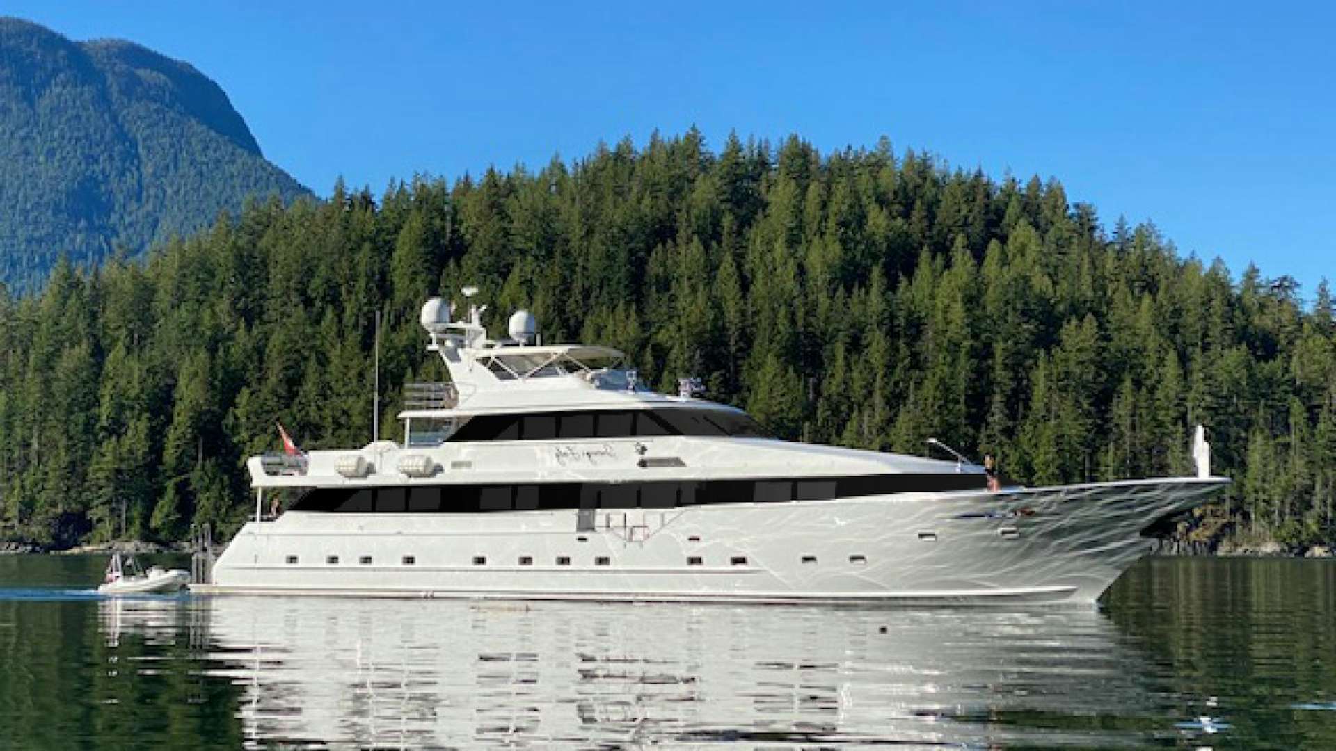 a large boat on the water aboard SOVEREIGN LADY Yacht for Sale