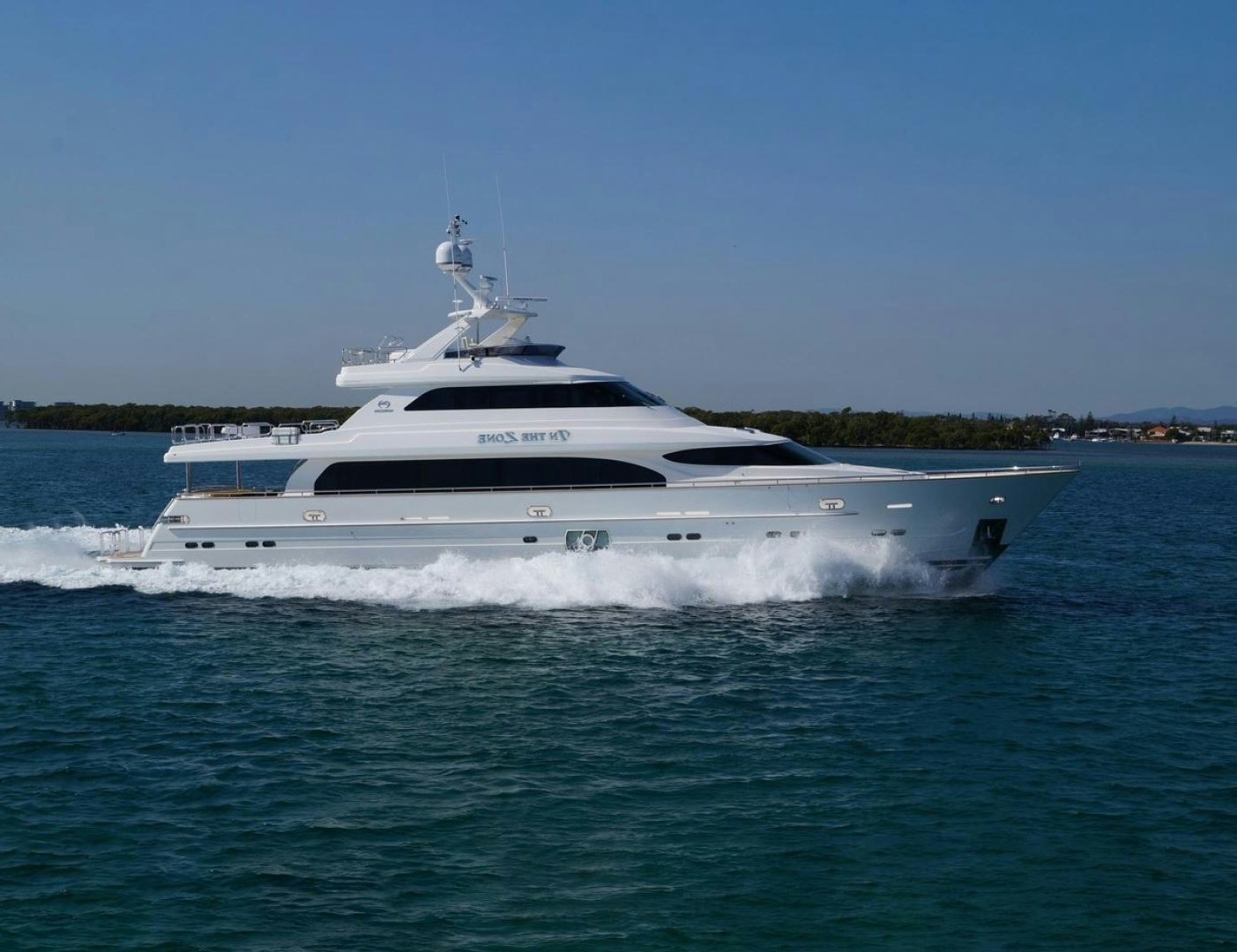 a white yacht on the water aboard IN THE ZONE Yacht for Sale