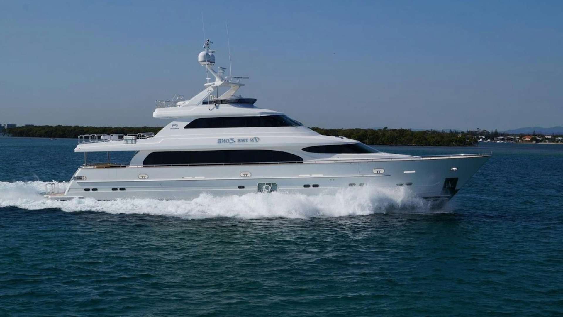 a white yacht on the water aboard IN THE ZONE Yacht for Sale