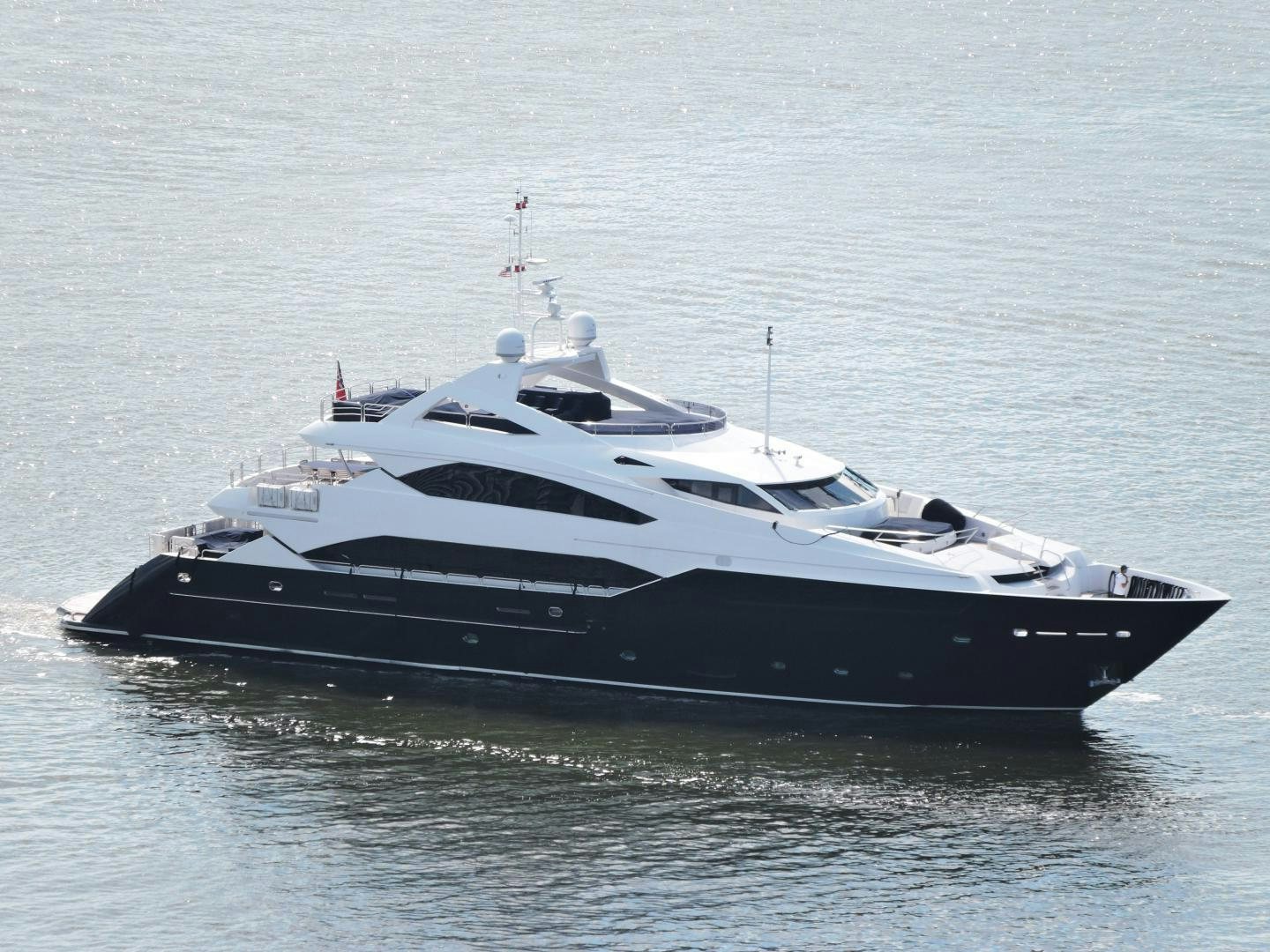 a black and white boat in the water aboard ACACIA Yacht for Sale