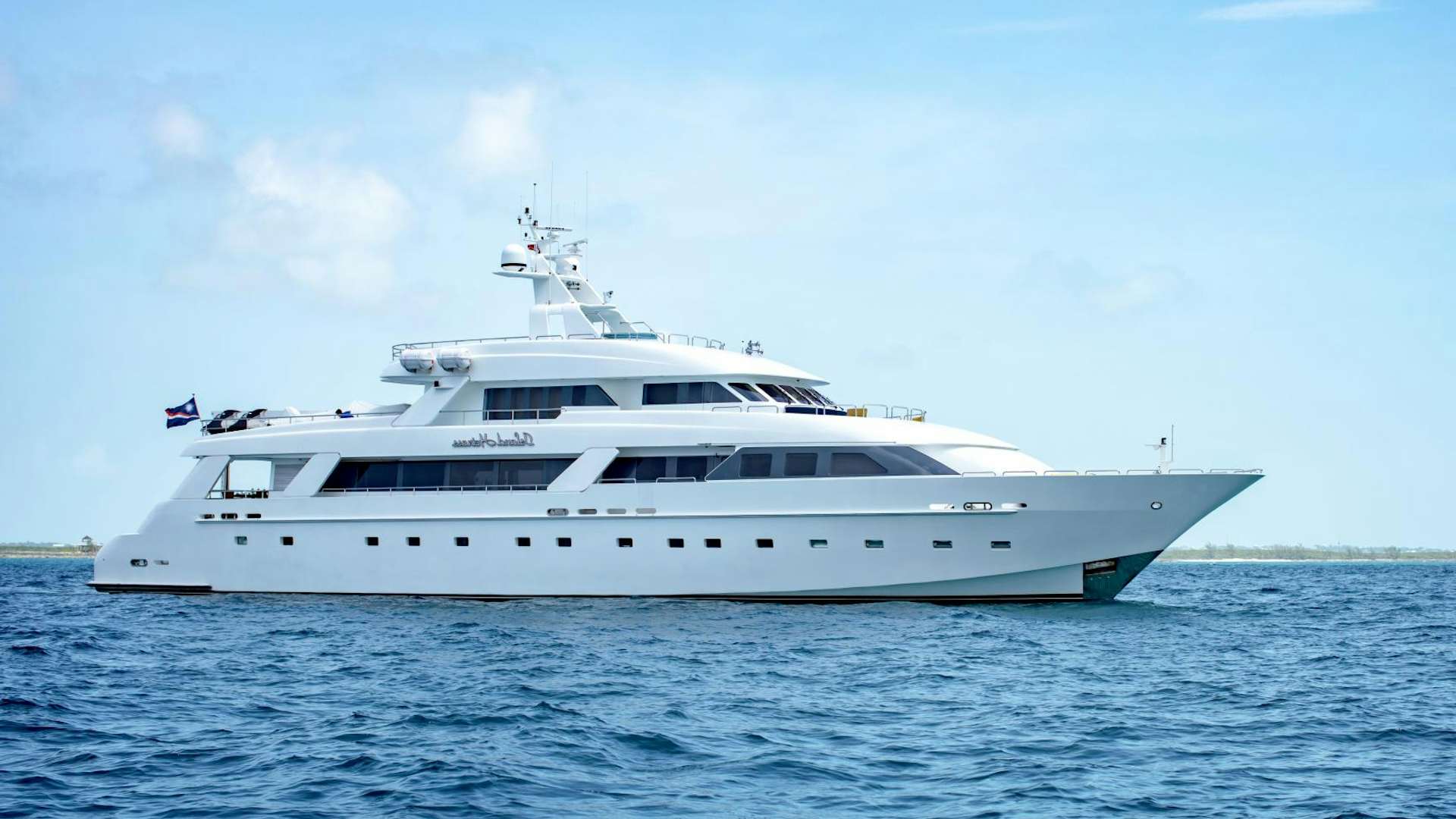 a white yacht in the water aboard ISLAND HEIRESS Yacht for Sale