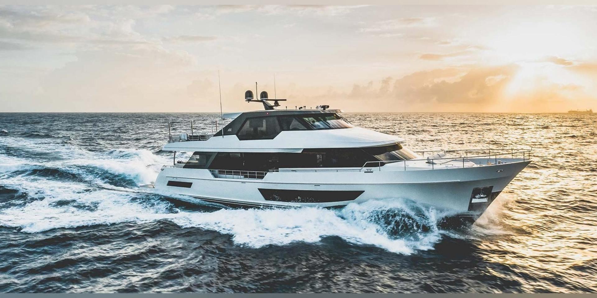 a white yacht on the water aboard CARBON COPY Yacht for Sale