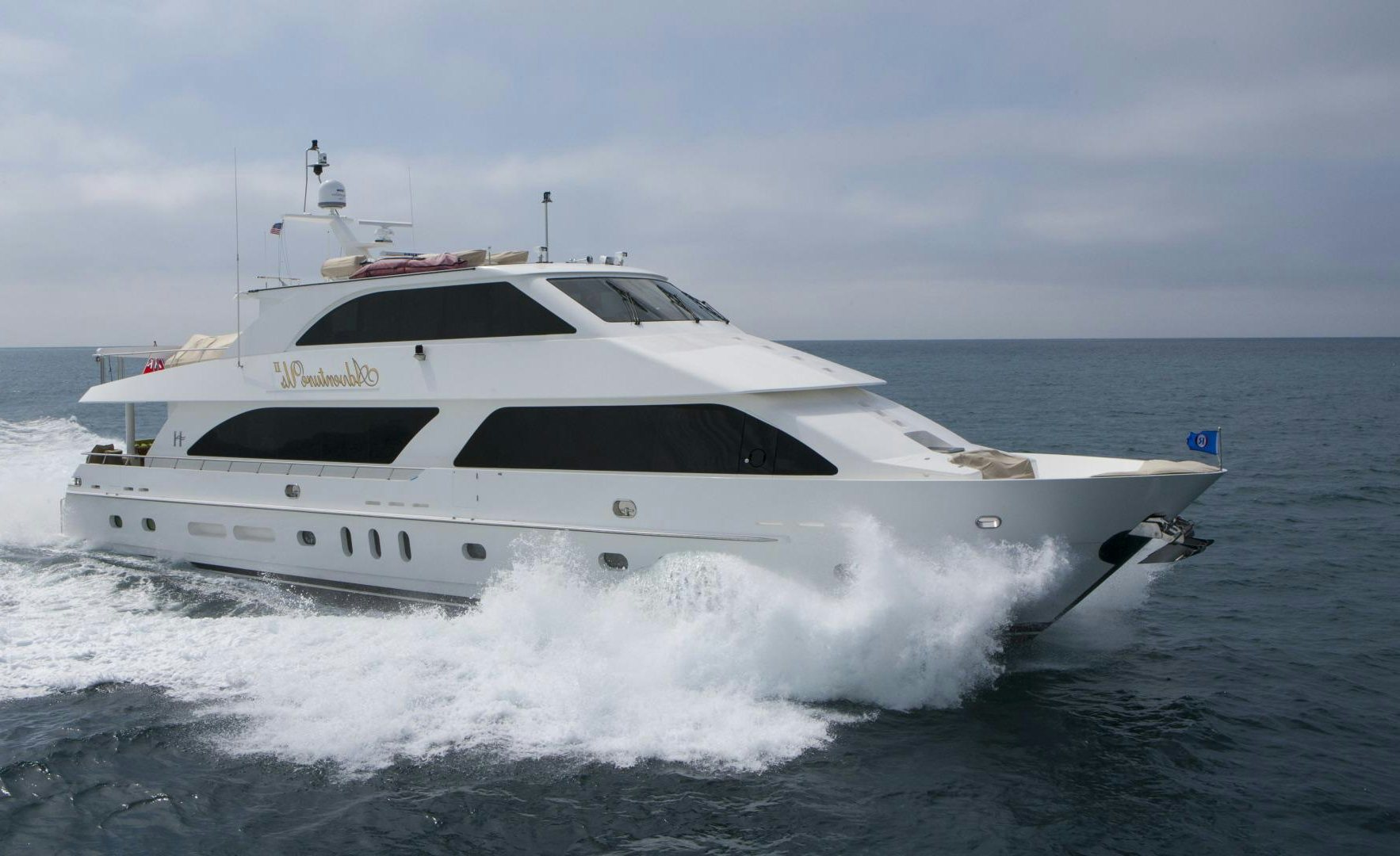 a white yacht on the water aboard ADVENTURE US II Yacht for Sale