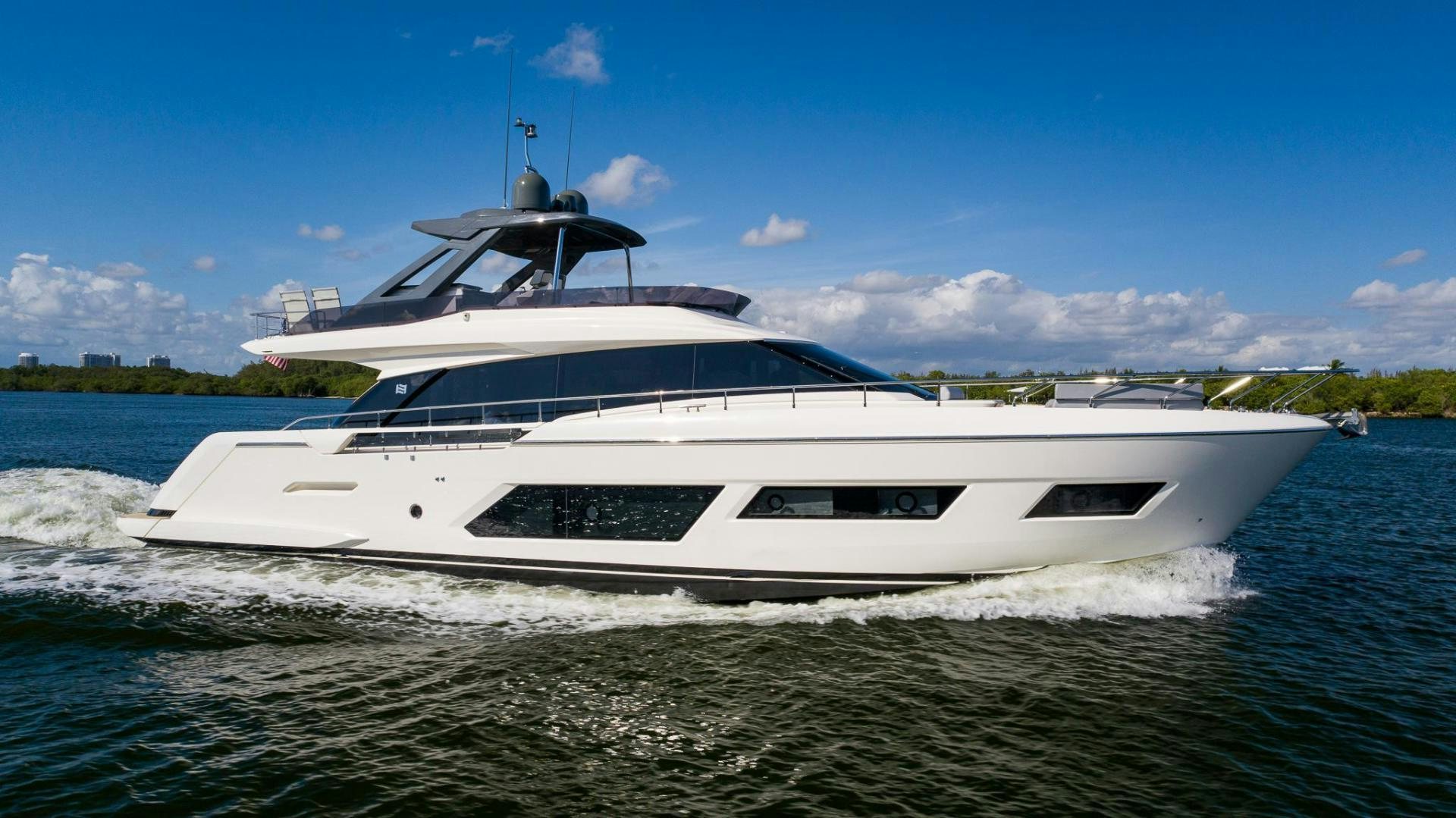 a white yacht on the water aboard LEGEND Yacht for Sale