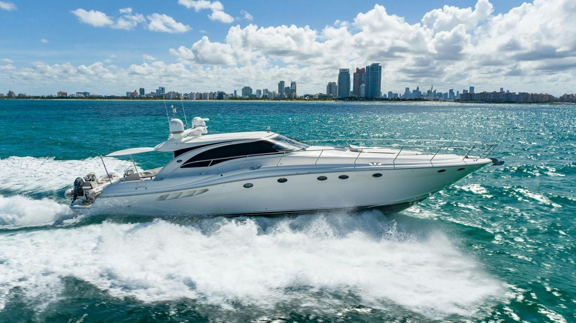 a white yacht in the water aboard XANADU Yacht for Sale