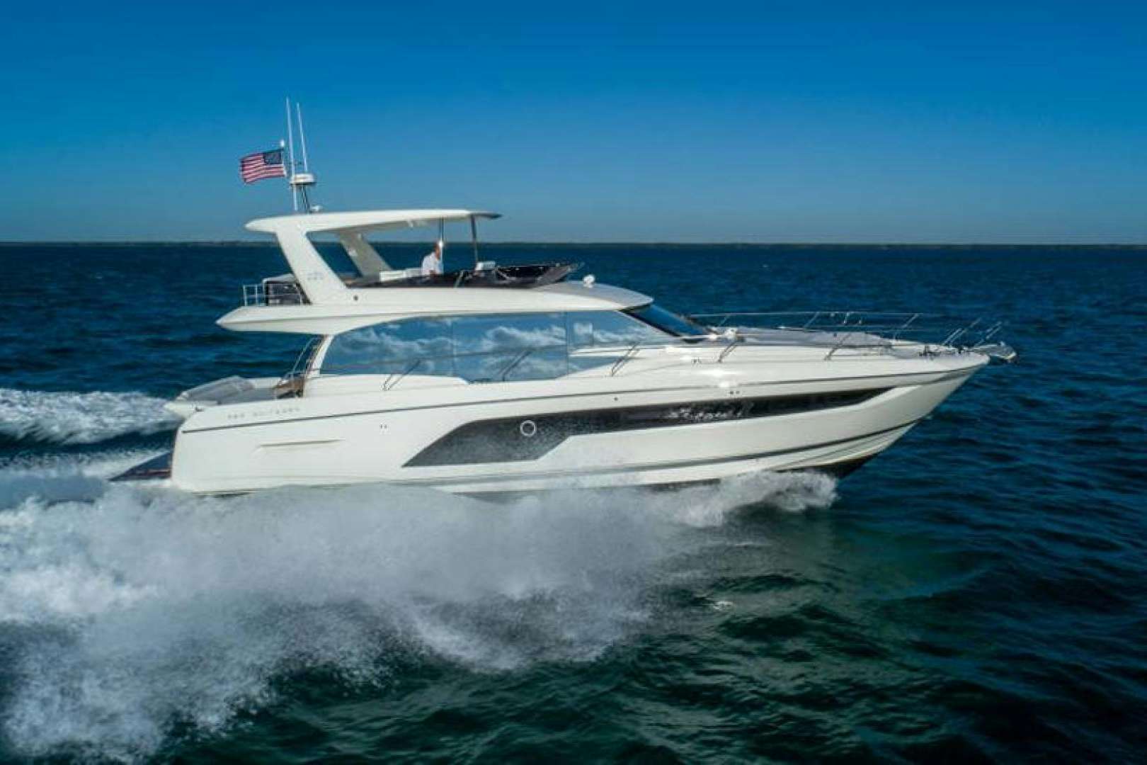 a white yacht on the water aboard FIFTH SEASON Yacht for Sale