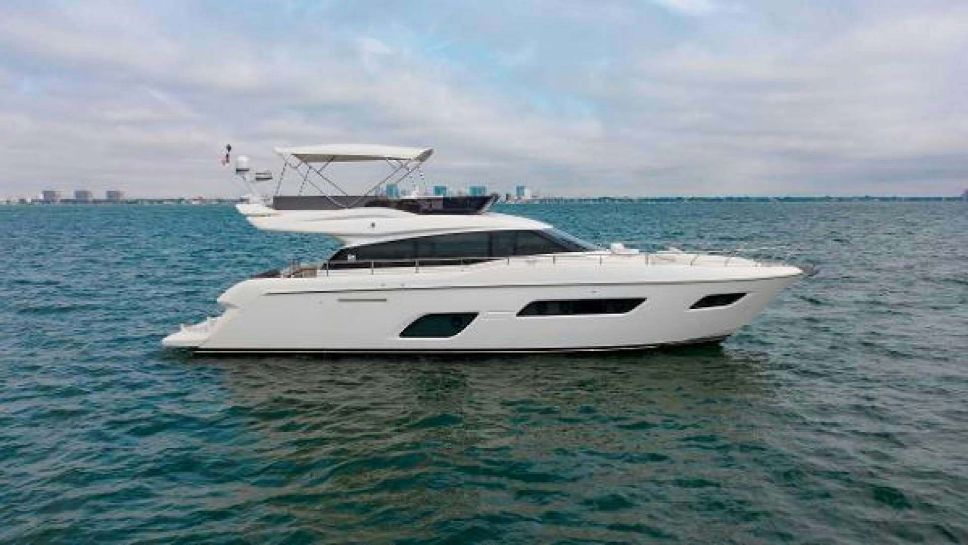 a white boat in the water aboard FERRETTI 550 Yacht for Sale