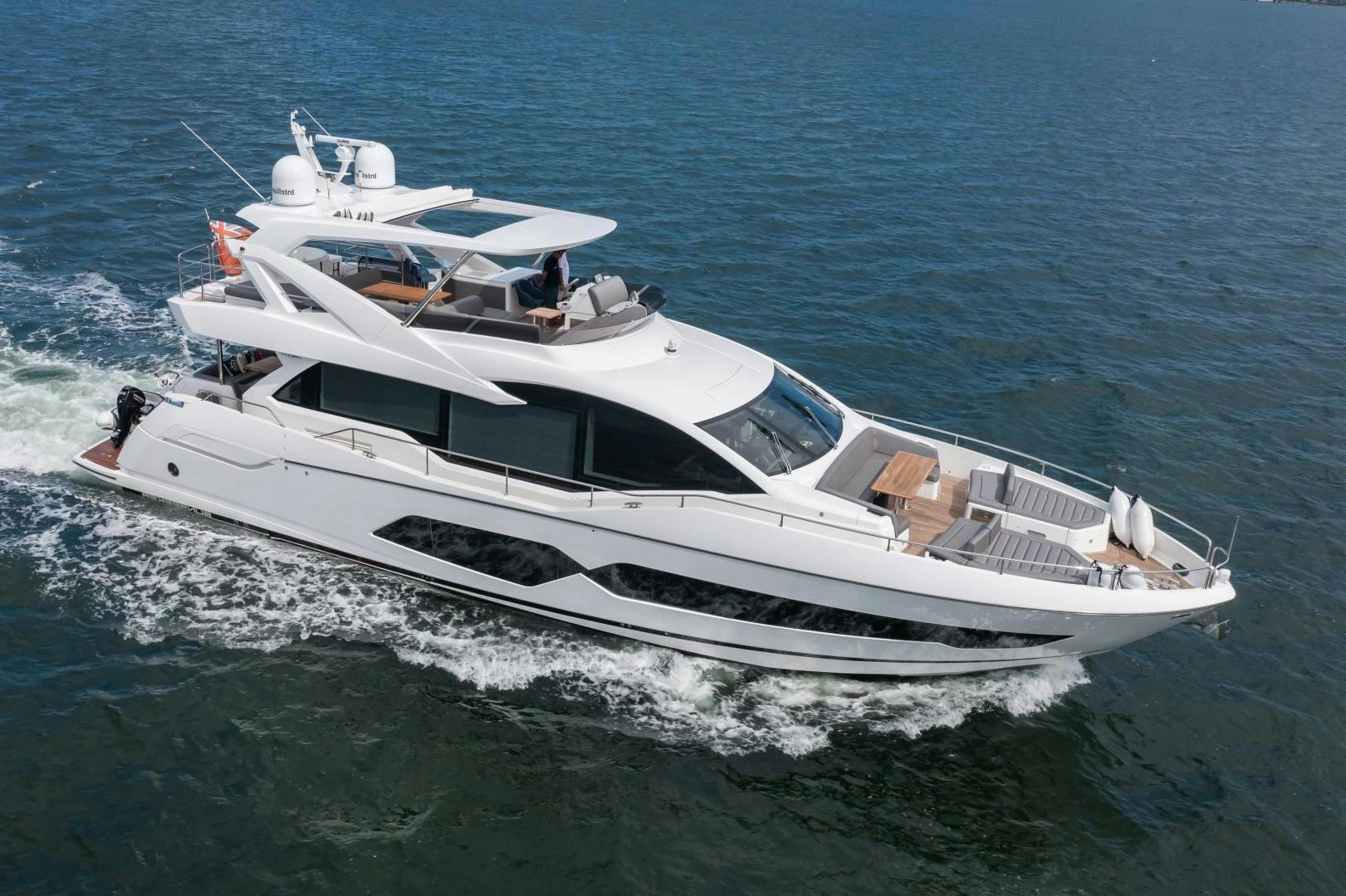 a white boat on the water aboard MR. G Yacht for Sale