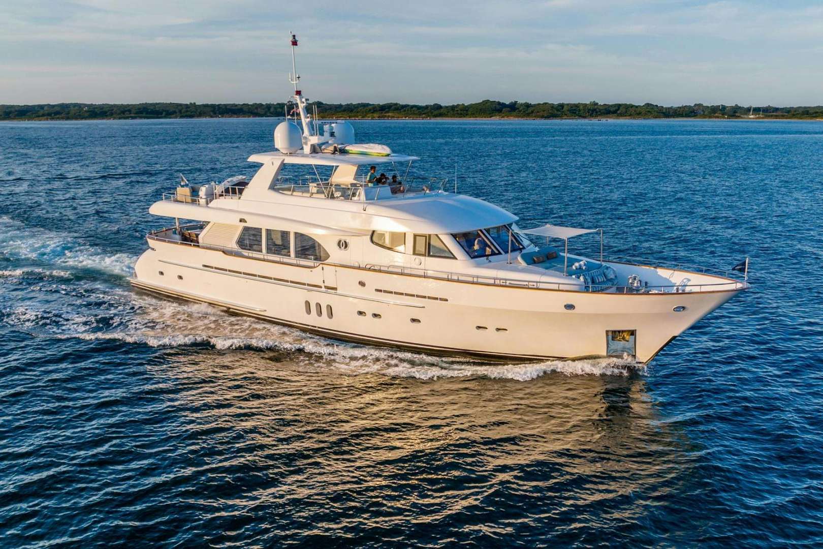 a white boat on the water aboard PURA VIDA Yacht for Sale