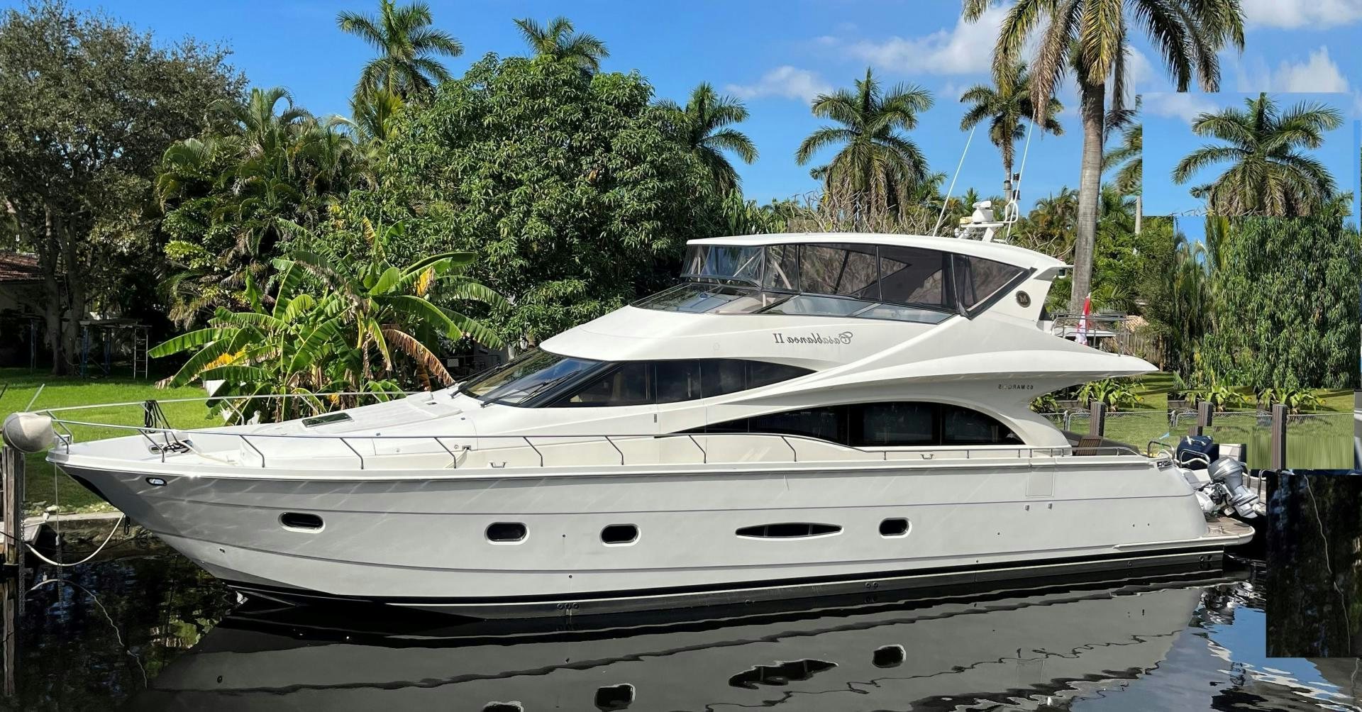 a white yacht on a beach aboard Casablanca II Yacht for Sale