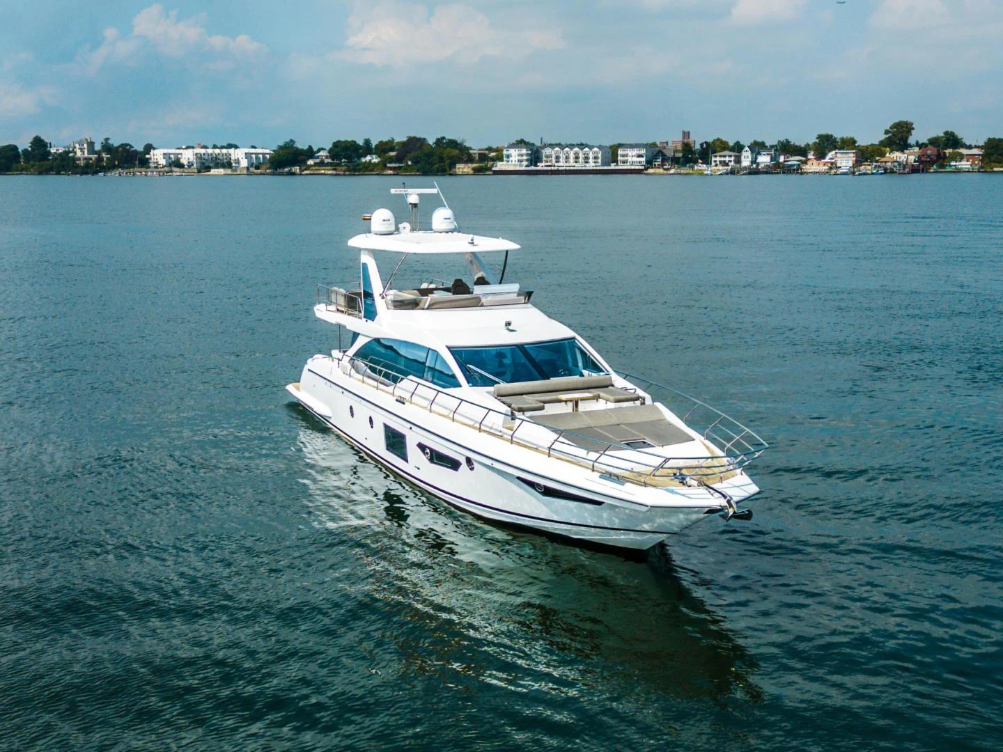 a white boat in the water aboard EVADO Yacht for Sale